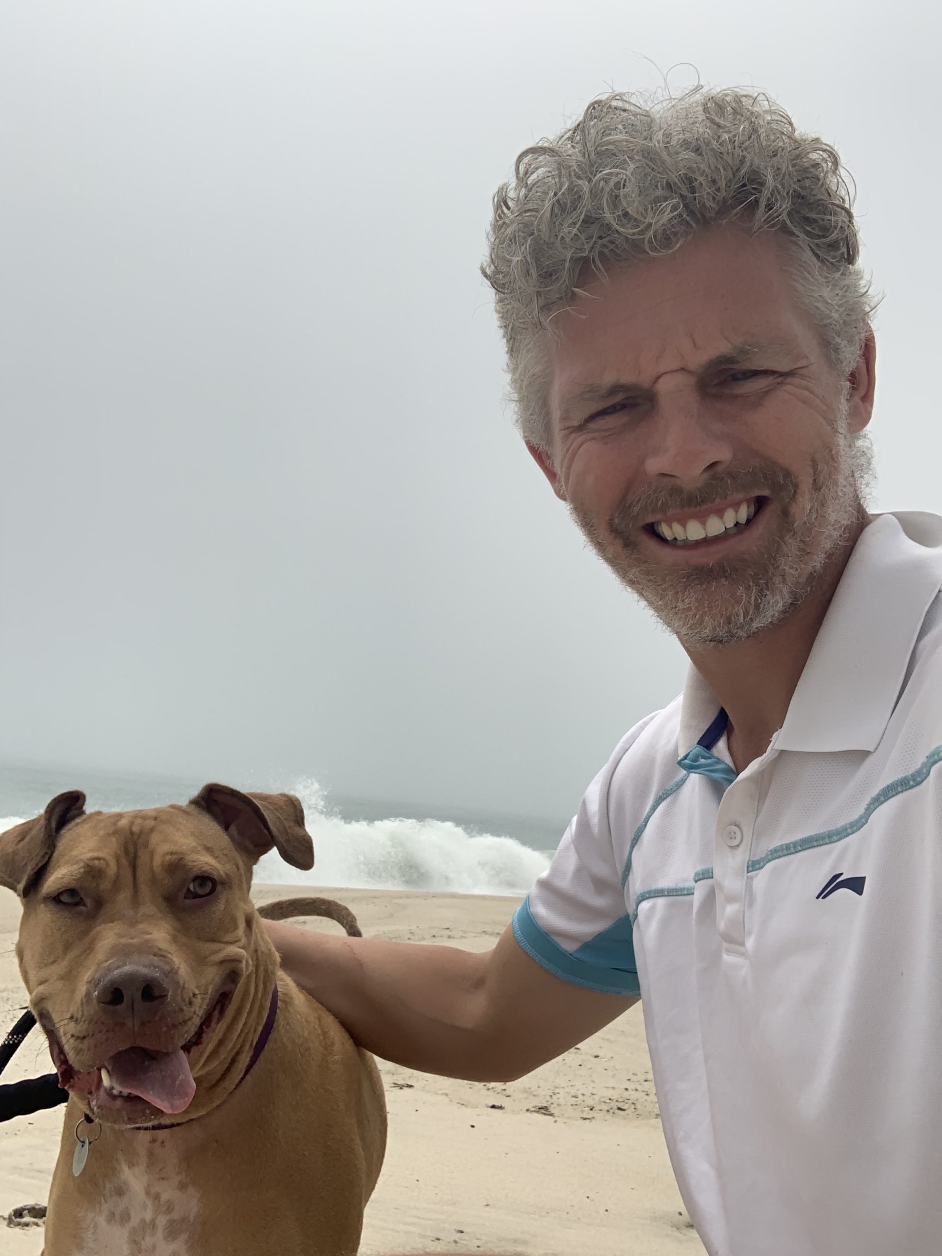 Des Bishop and his foster dog, Porsha, at the beach in West Hampton Dunes.