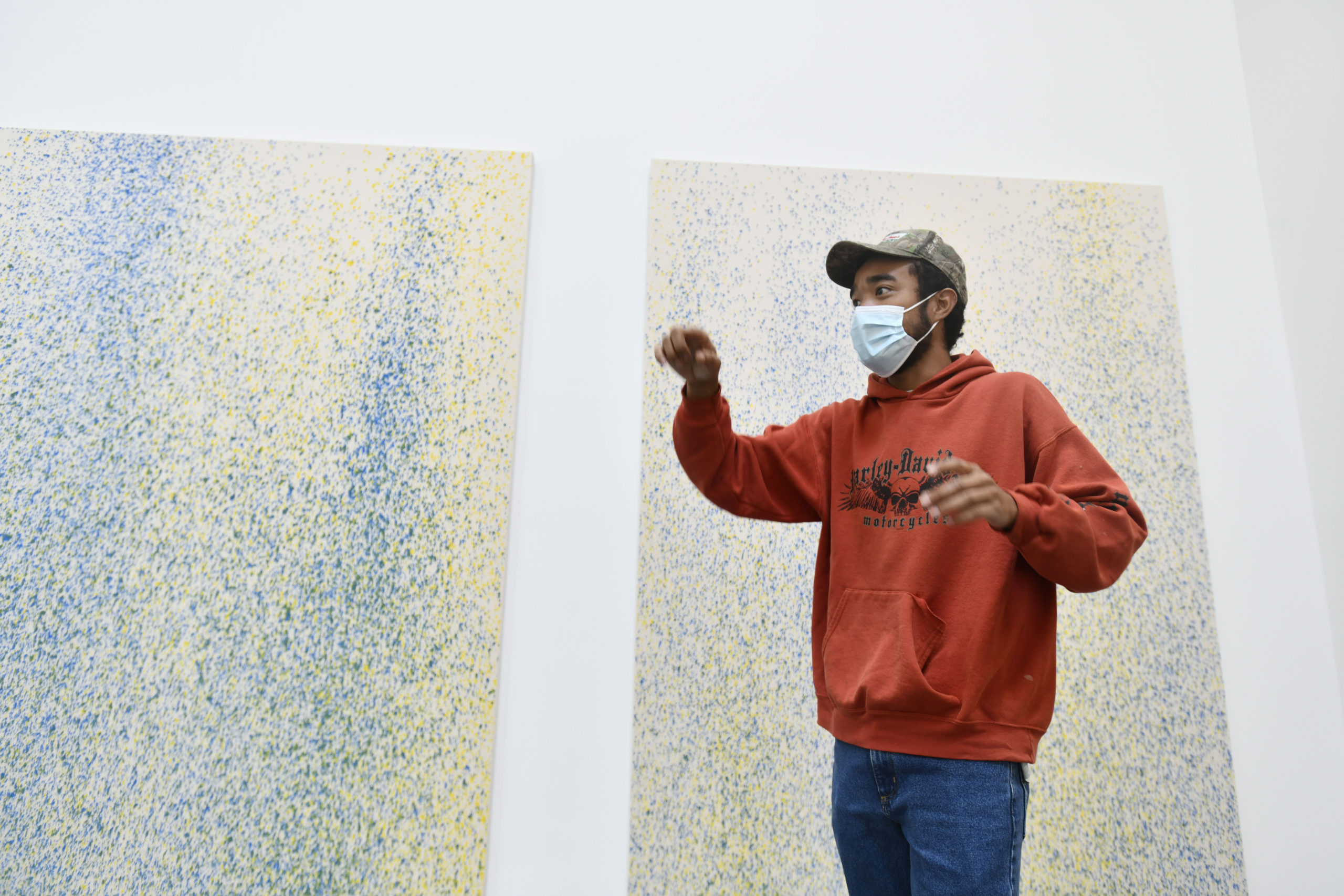 Artist Lucien Smith talks about his work “Southamtpon Suite,” duirng a private tour on Friday at the Parrish Art Museum.  DANA SHAW
