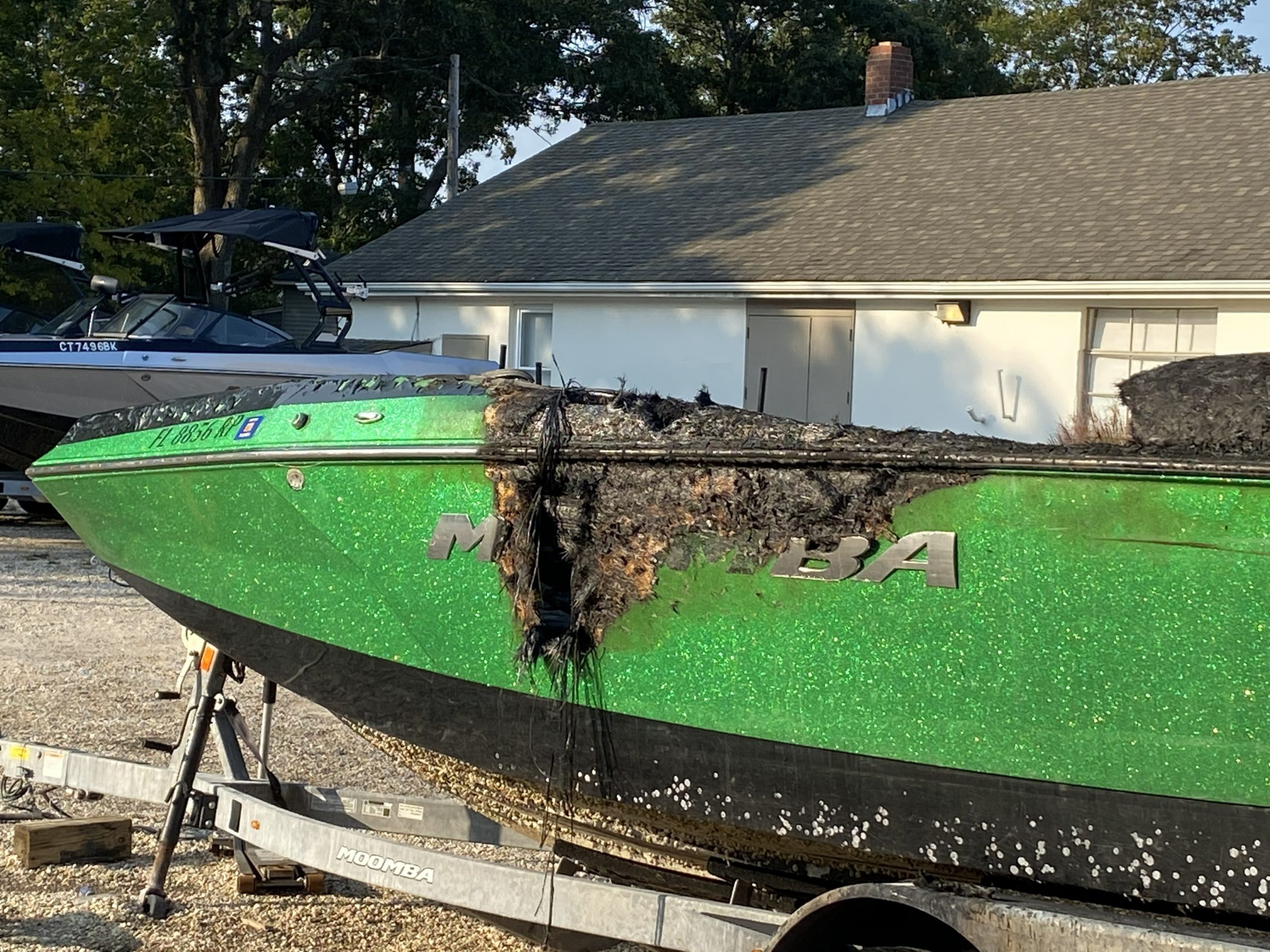 One of the boats that sustained heavy damage in a fire at Hidden Cove Marina in Noyac Friday night. ELLEN DIOGUARDI