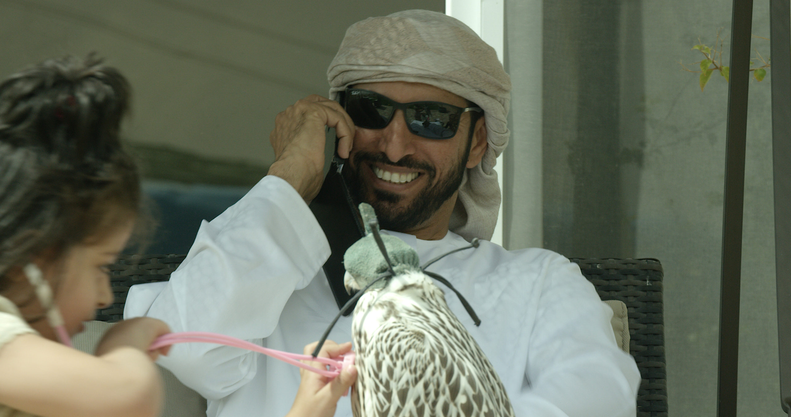 Khalifa Bin Mujren and daughter with falcon in Dubai, UAE.