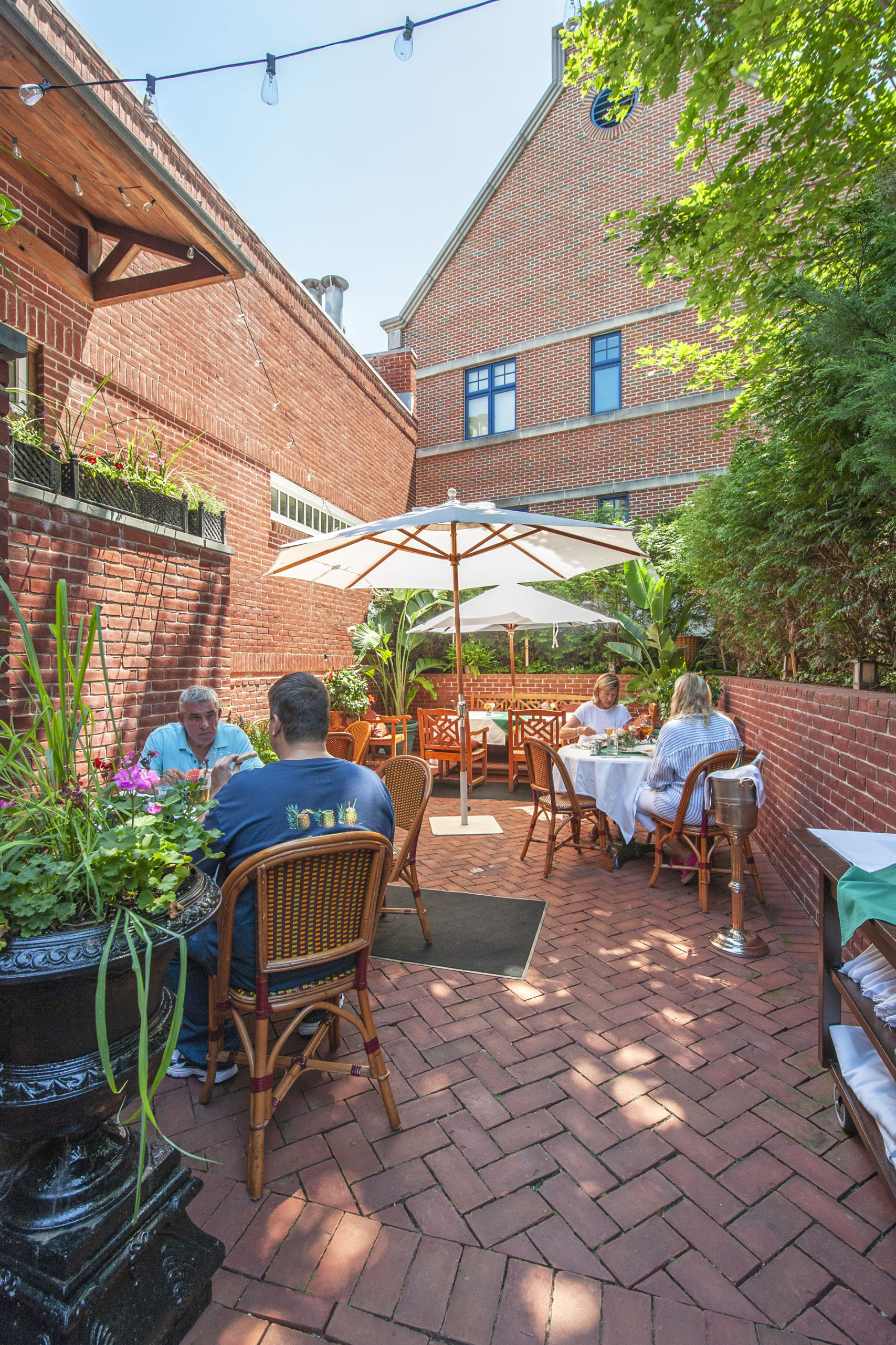 The outdoor courtyard dining area behind The American Hotel.