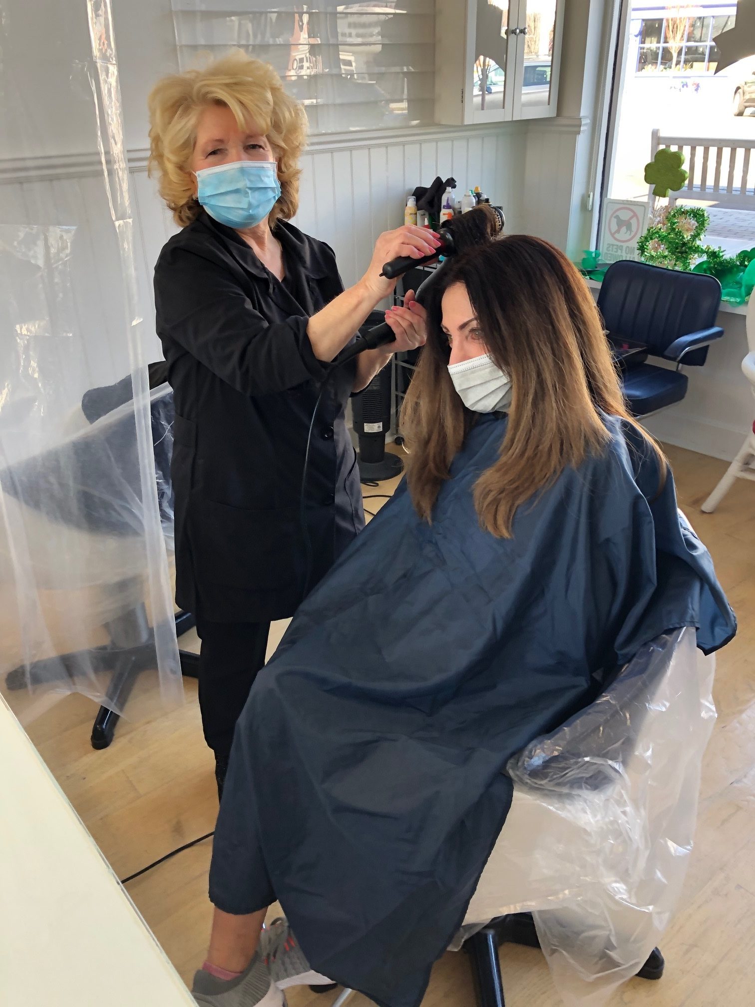 Lillian Schon styles a client's hair at her salon in Westhampton Beach.