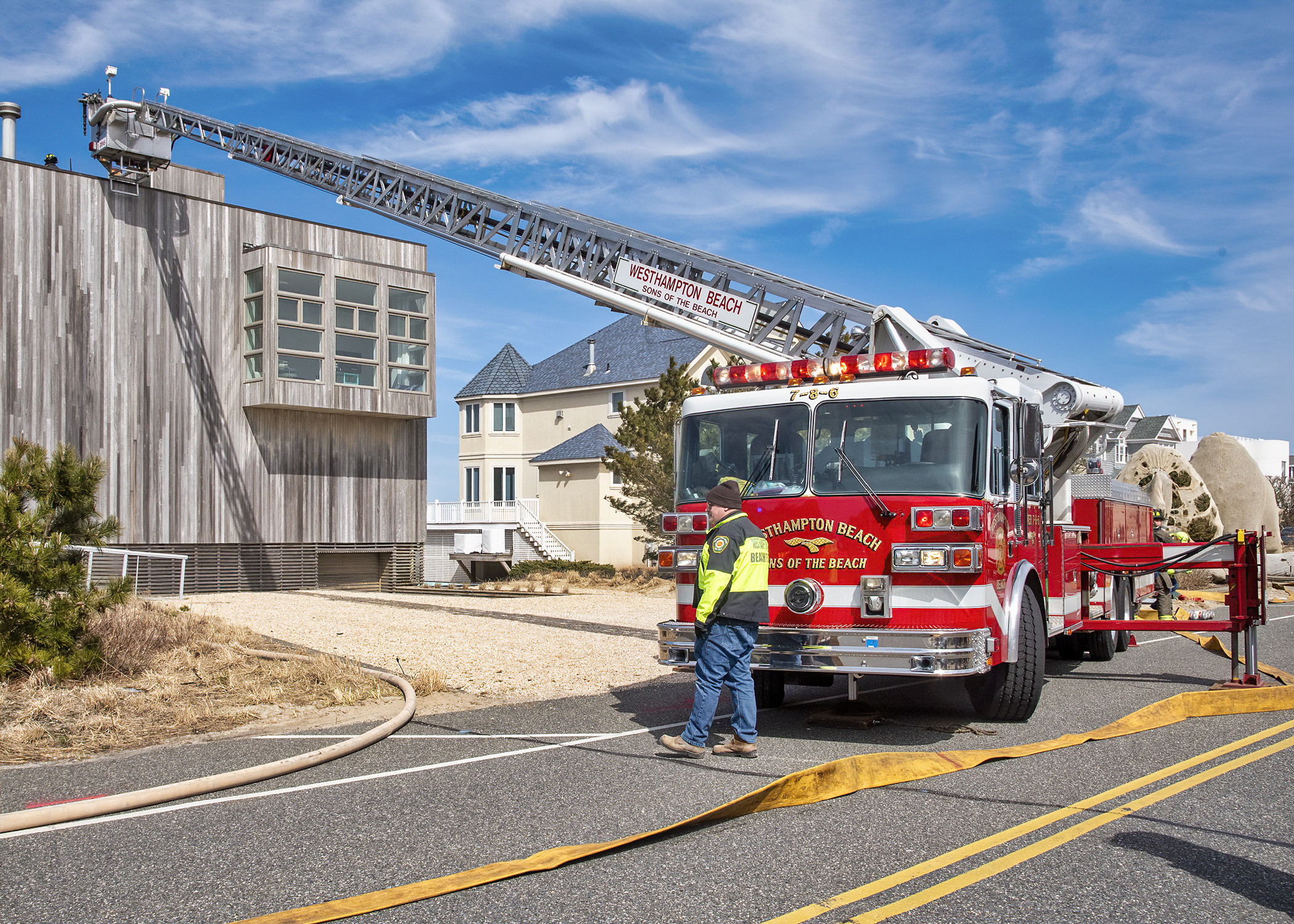 Firefighters from the Westhampton Fire Department, assisted by neighboring departments, extinguished a fire on the roof of a house on Dune Road in West Hampton Dunes on the afternoon of Friday, March 19. COURTESY WESTHAMPTON BEACH FIRE DEPARTMENT