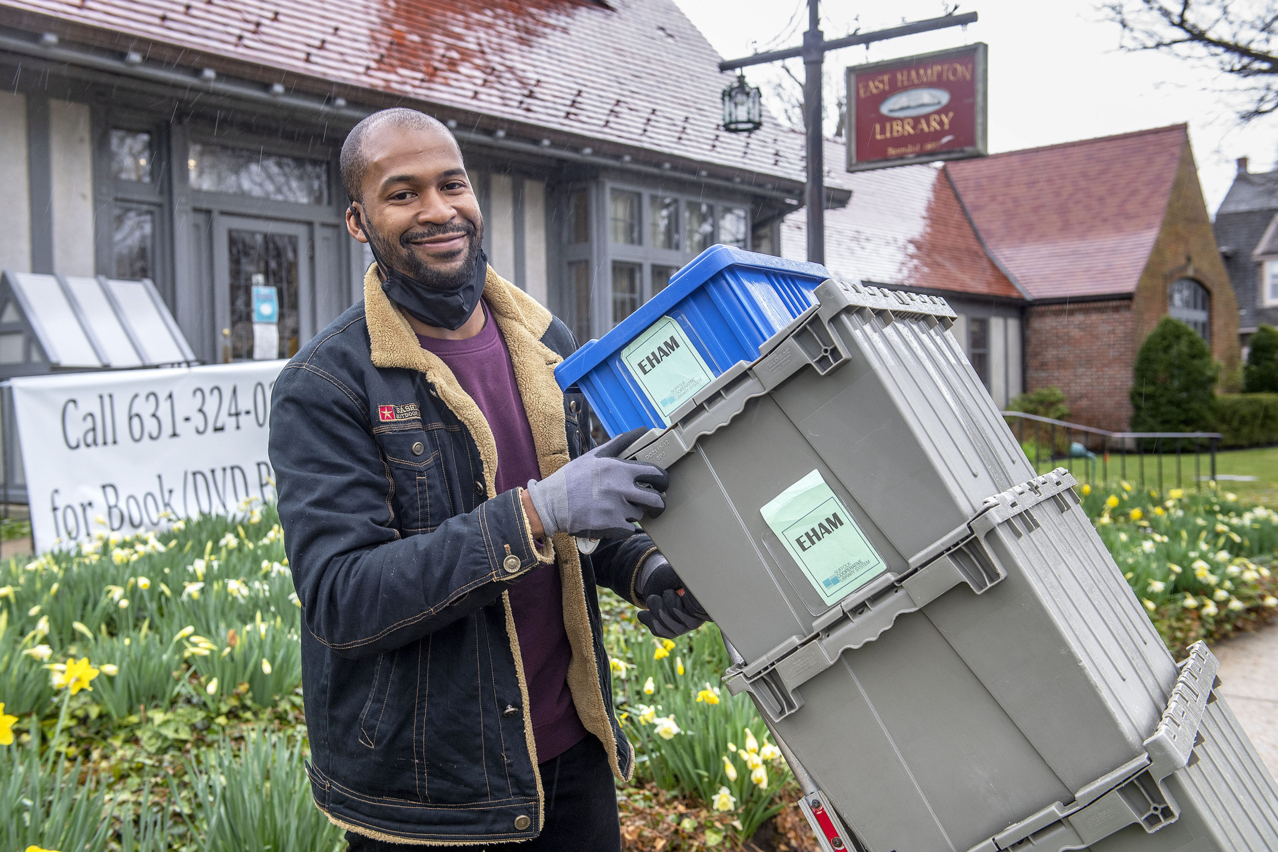Suffolk Cooperative Library System Senior Driver Tyrell Jasper makes a stop at East Hampton Library.