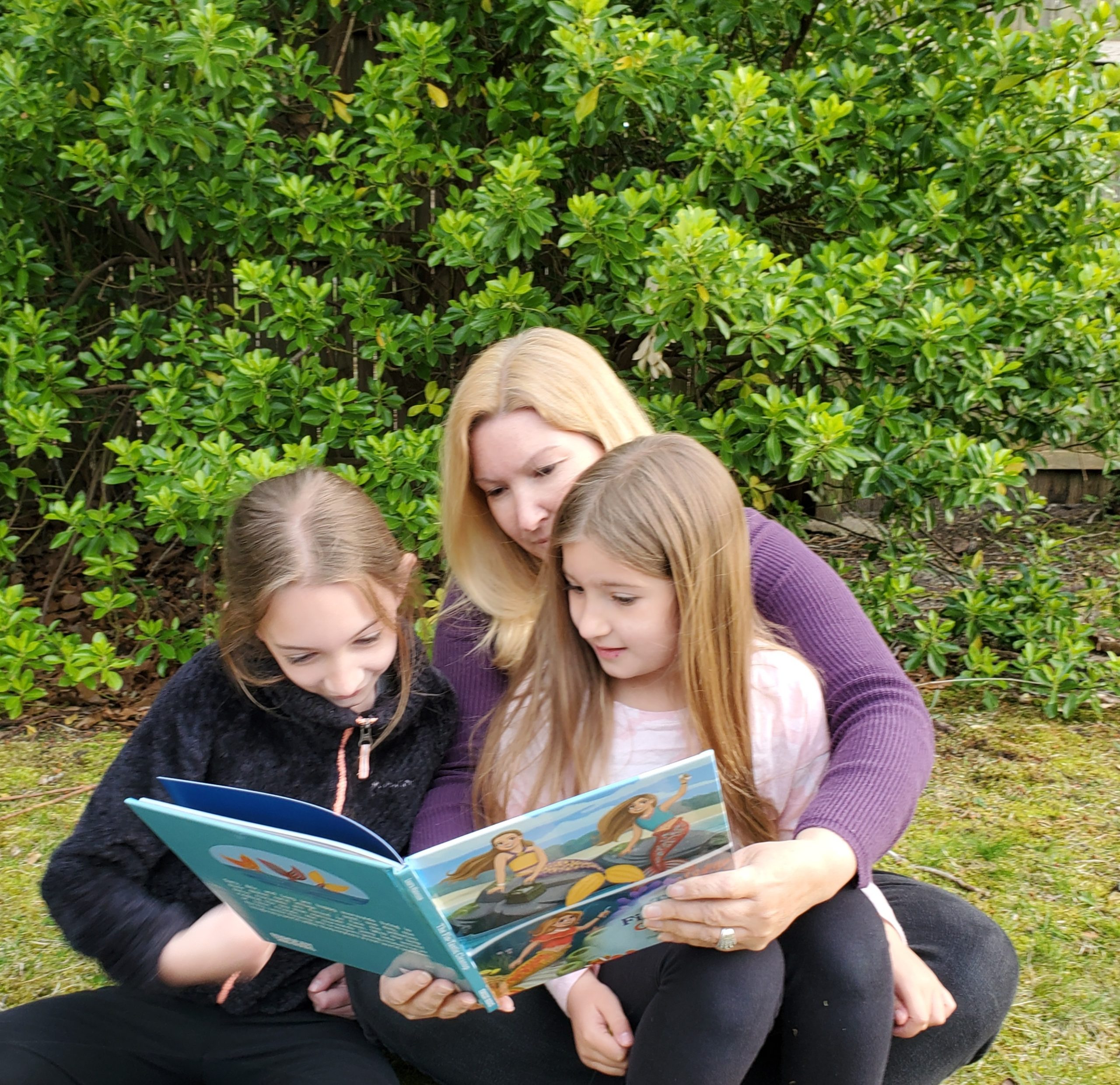 Author Laura Mancuso reading her book with daughters Sarafina, 9, and Lucia, 7, who were the inspiration behind the story.