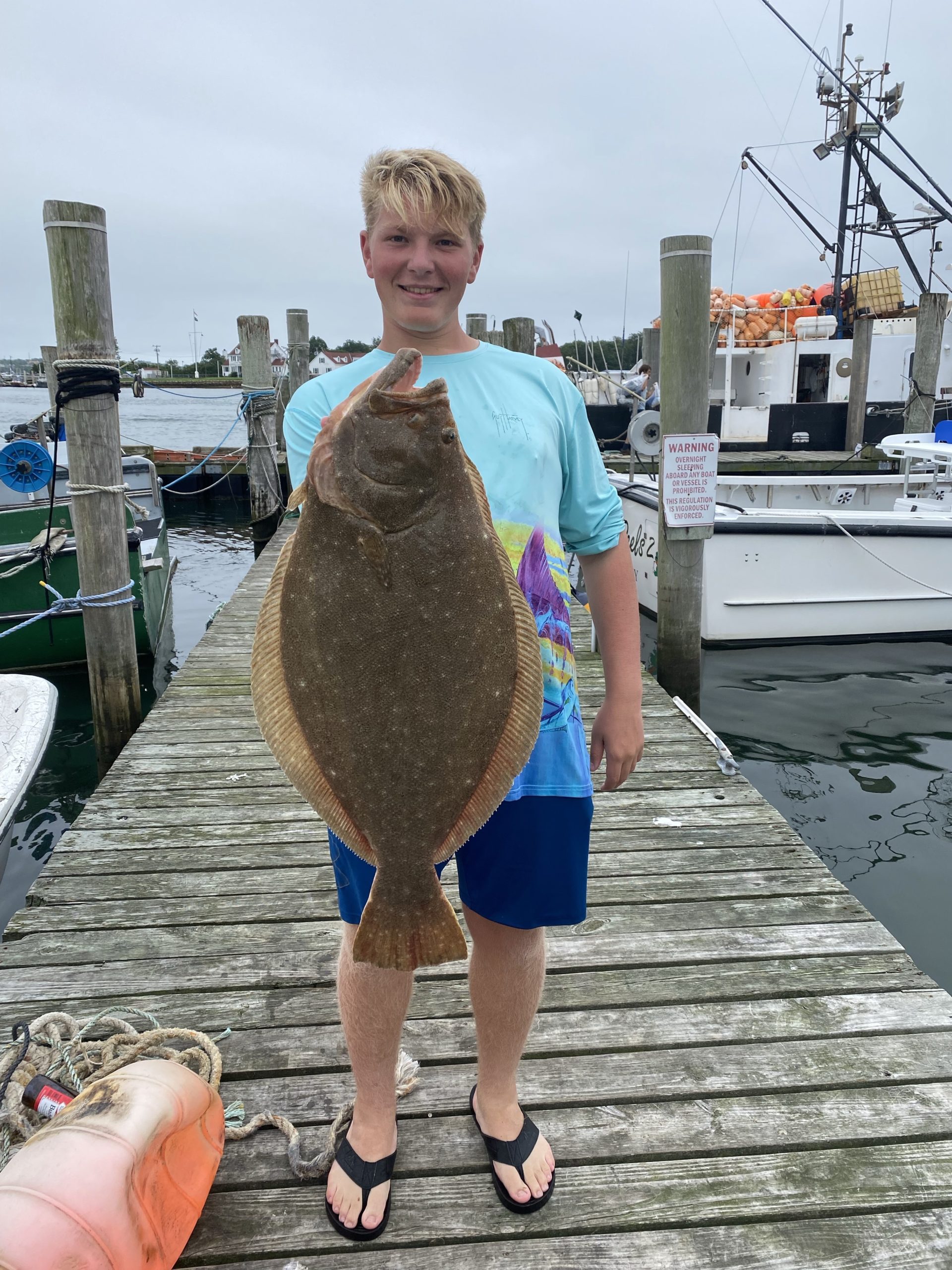 T.J. Wallace with a 13-pound fluke he caught out of Montauk recently.