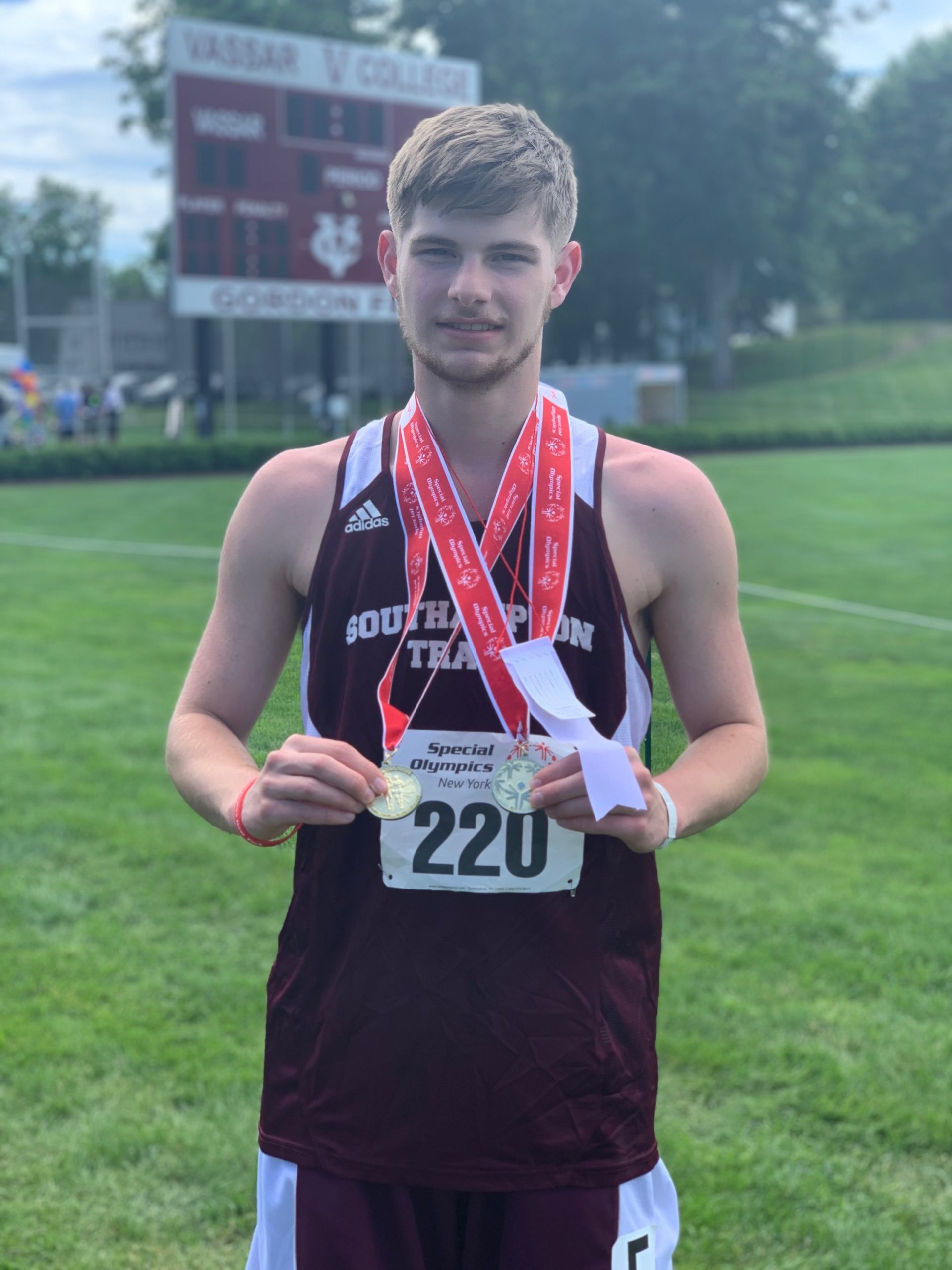 Ross Ebrus with multiple medals he won earlier this year.