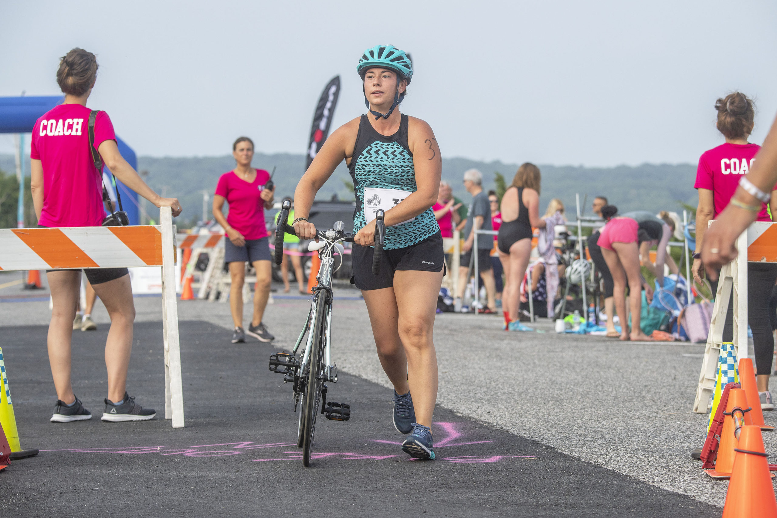 Competitors transition from swimming to biking for the second leg of the Hamptons Young at Heart Triathlon.