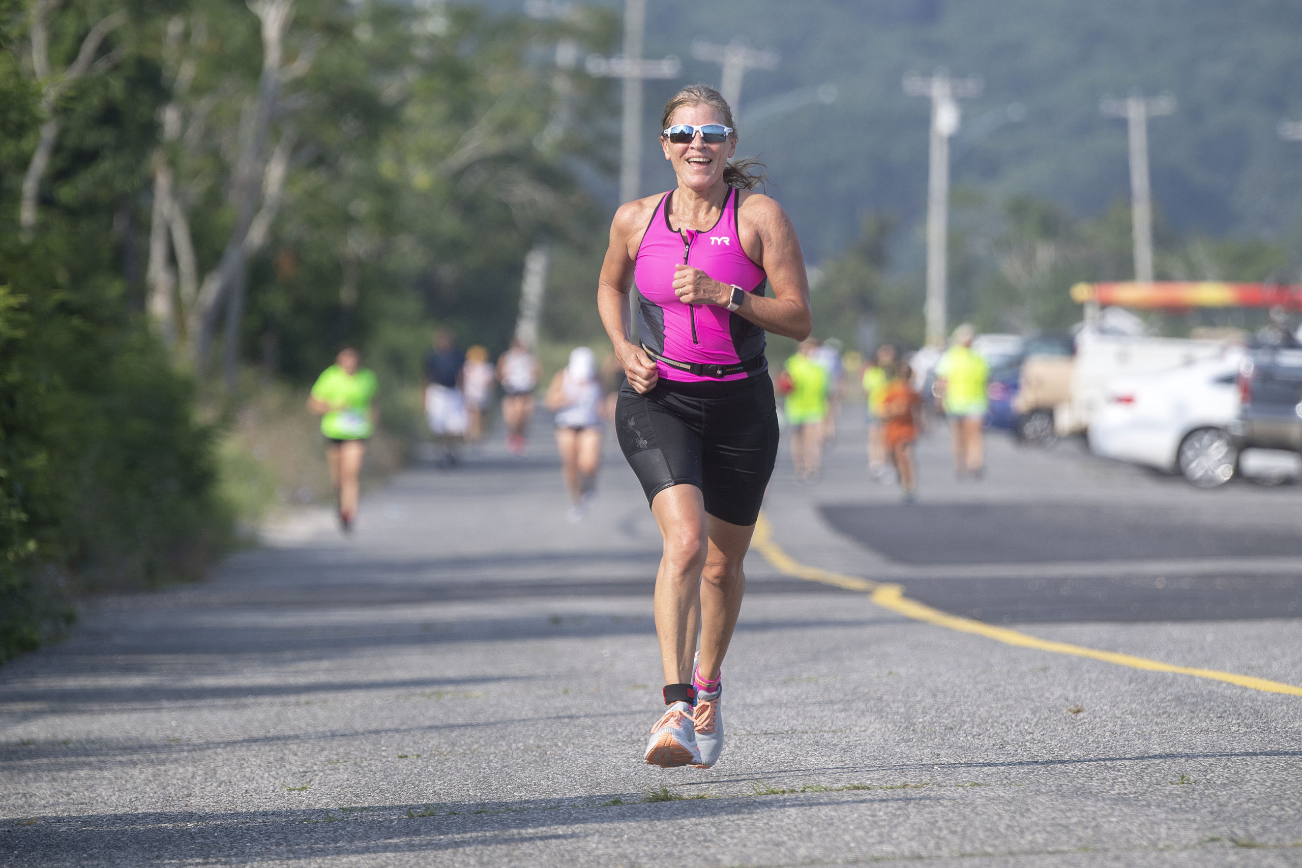 Kim Covell, assistant editor for the Express News Group, competes in the 1.5 mile run leg of the Hamptons Young at Heart Triathlon, held at Long Beach in Sag Harbor this past Saturday, July 17.