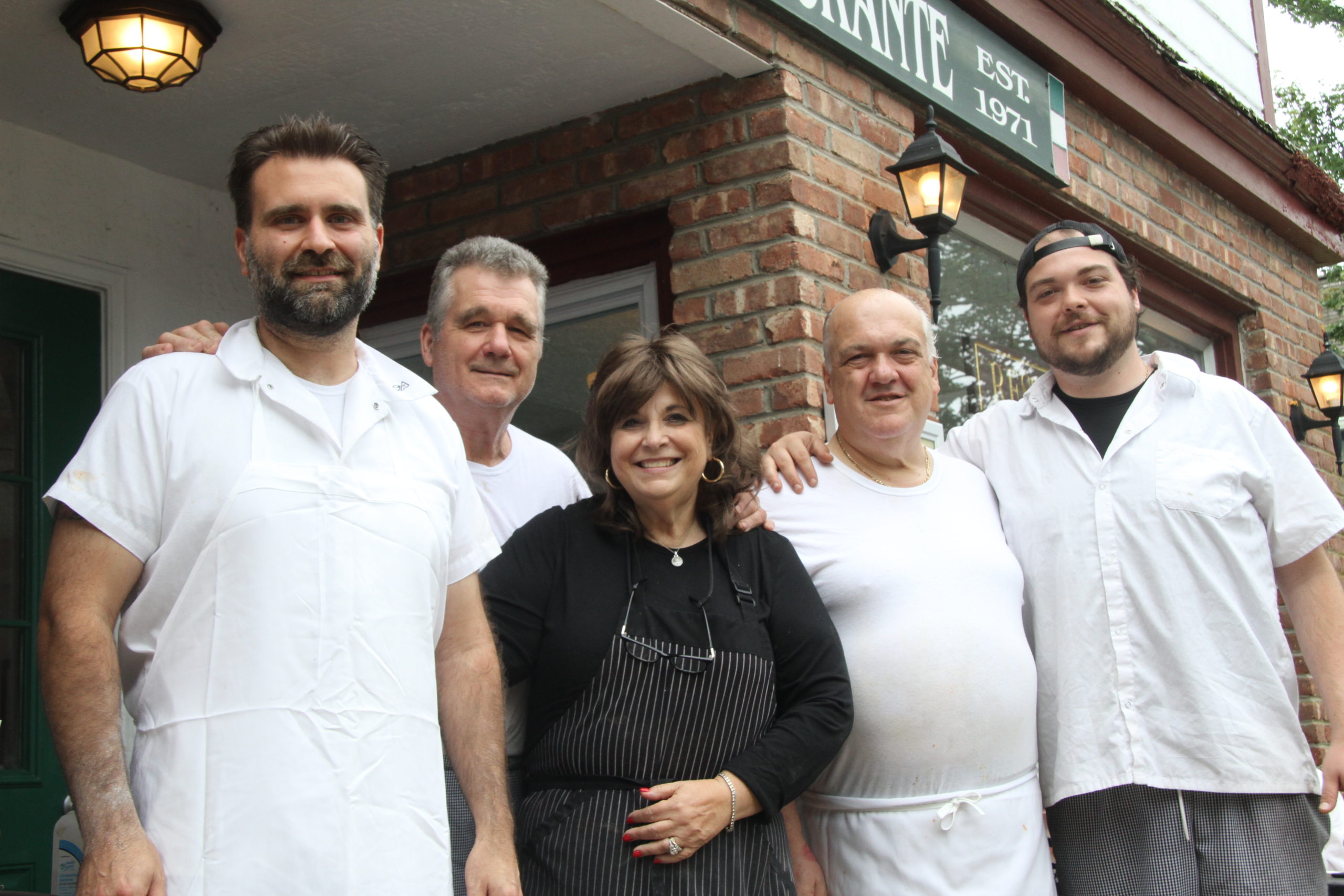 Anthony, Nado and Alda Stipanov, left, and Tony and Joe Lupo, have sold Astro's Pizza and Felice's Ristorante in Amagansett after 50 years in business. The new owners are expected to continue selling pizza and adding an ice cream parlor.
