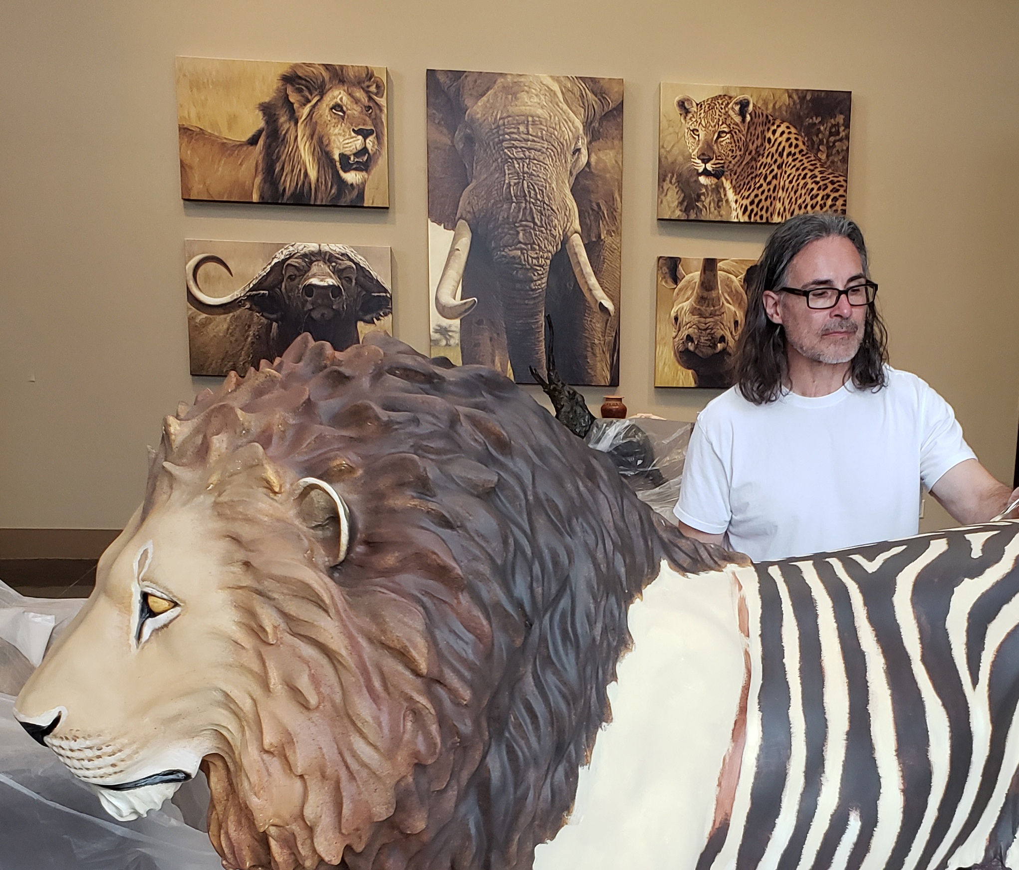 John Banovich works on his lion sculpture, 