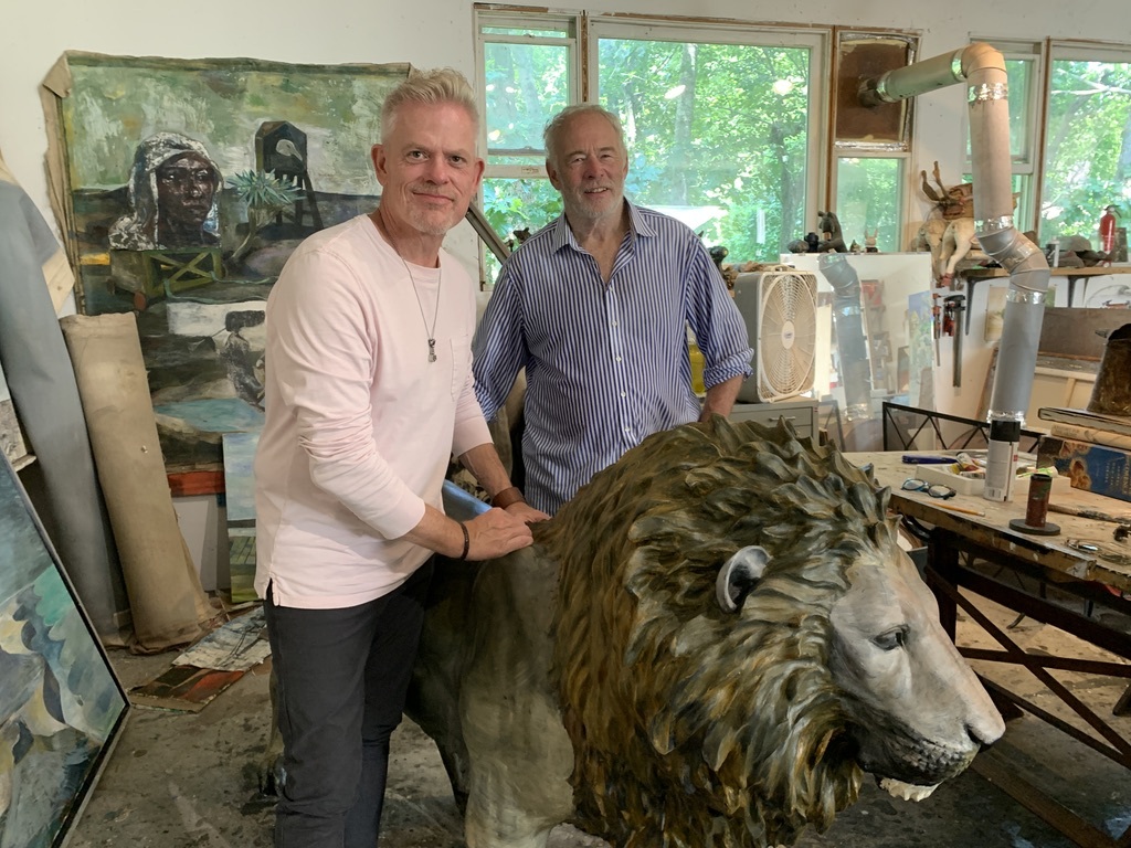 Brady Forseth, CEO of the African Community & Conservation Foundation, with artist Paton Miller and his artistic lion in his Southampton studio.