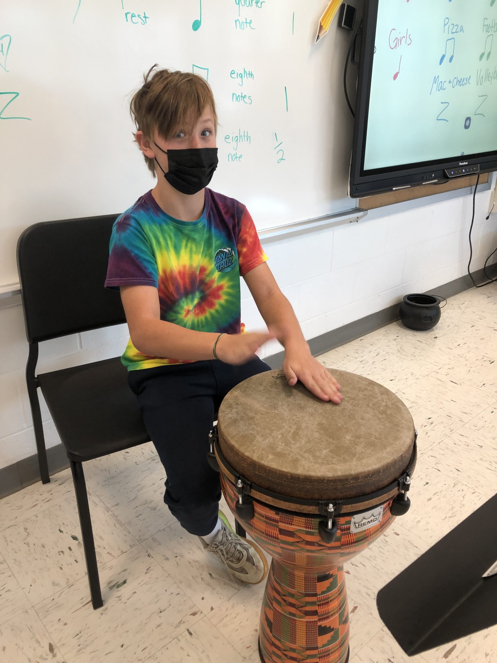 East Quogue Elementary School fifth-grader Nolan Drake performing a rhythm he write on the djembe.