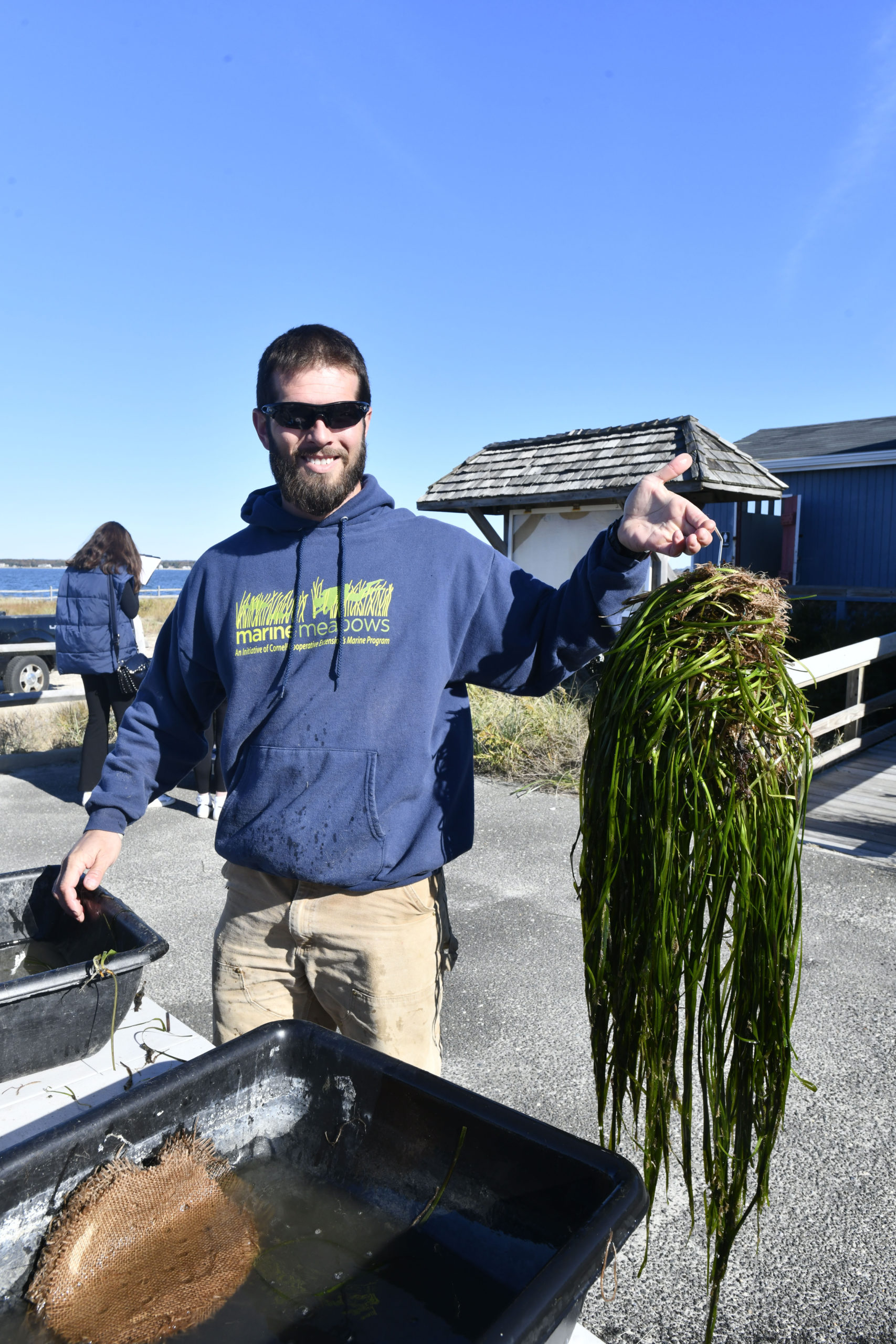 Jason Havelin of Cornell Cooperative Extension with some of the finished eelgrass.  DANA SHAW