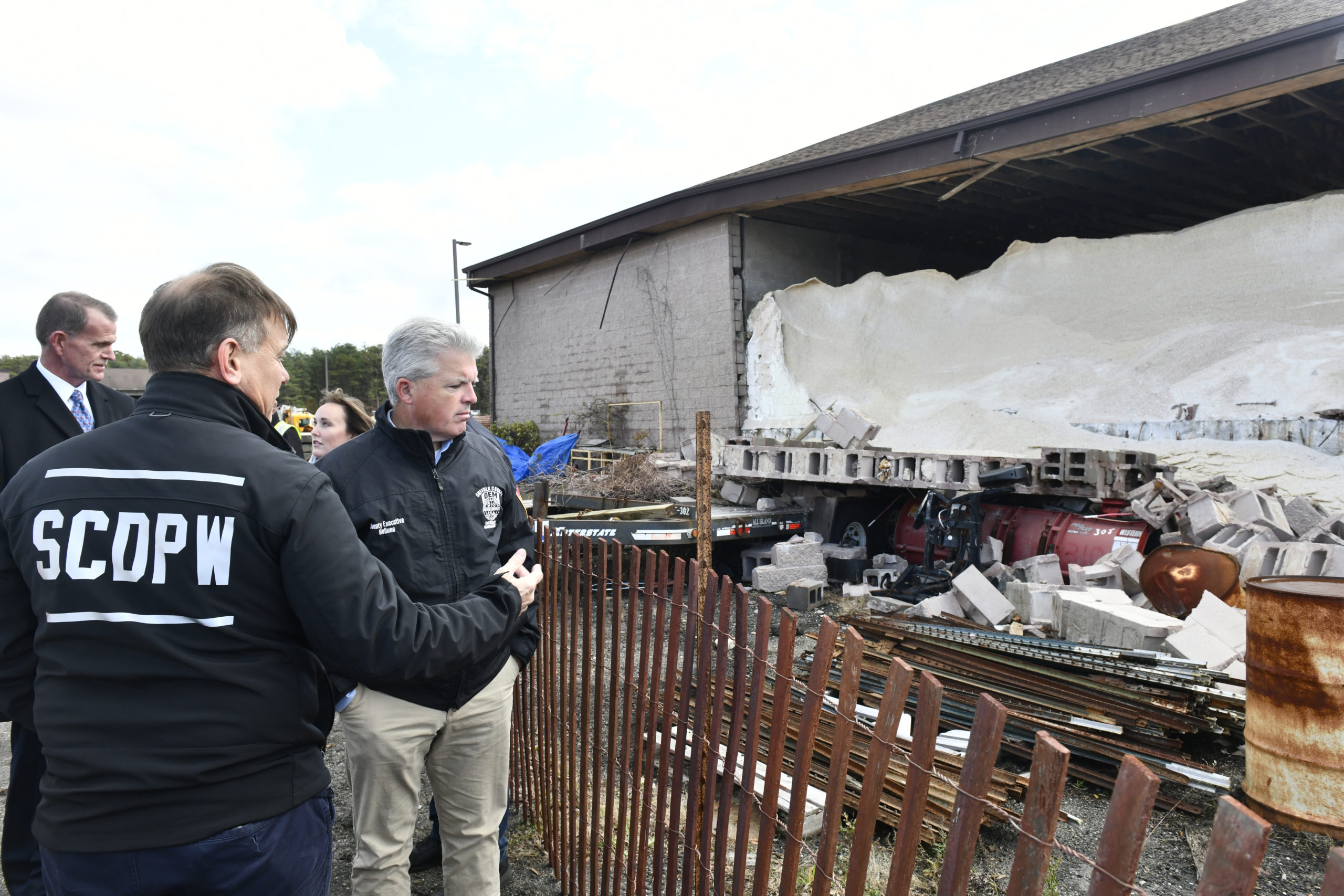 Suffolk County Executive Steve Bellone surveys the damage at the Suffolk County DPW yard and salt barn in Westhampton which sustained significant damage from a confirmed tornado on Saturday leaving it structurally unsound.      DANA SHAW