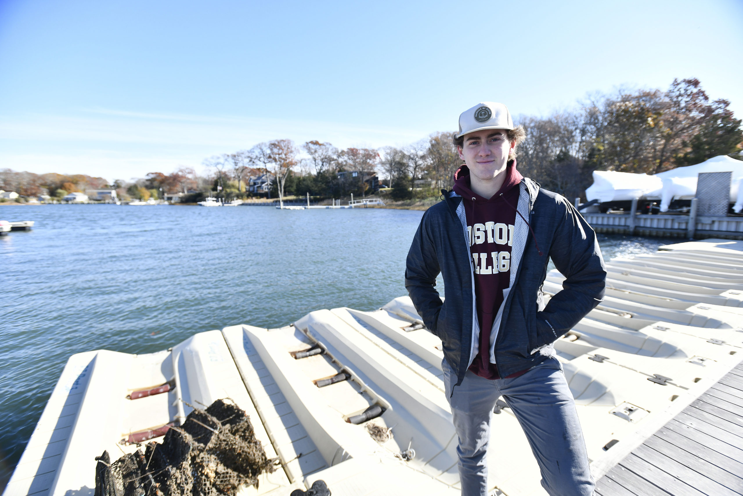 Pierson Senior Reed Kelsey at Mill Creek Marina in Noyac where he is working on a shellfish restoration project with oysters and scallops.  DANA SHAW