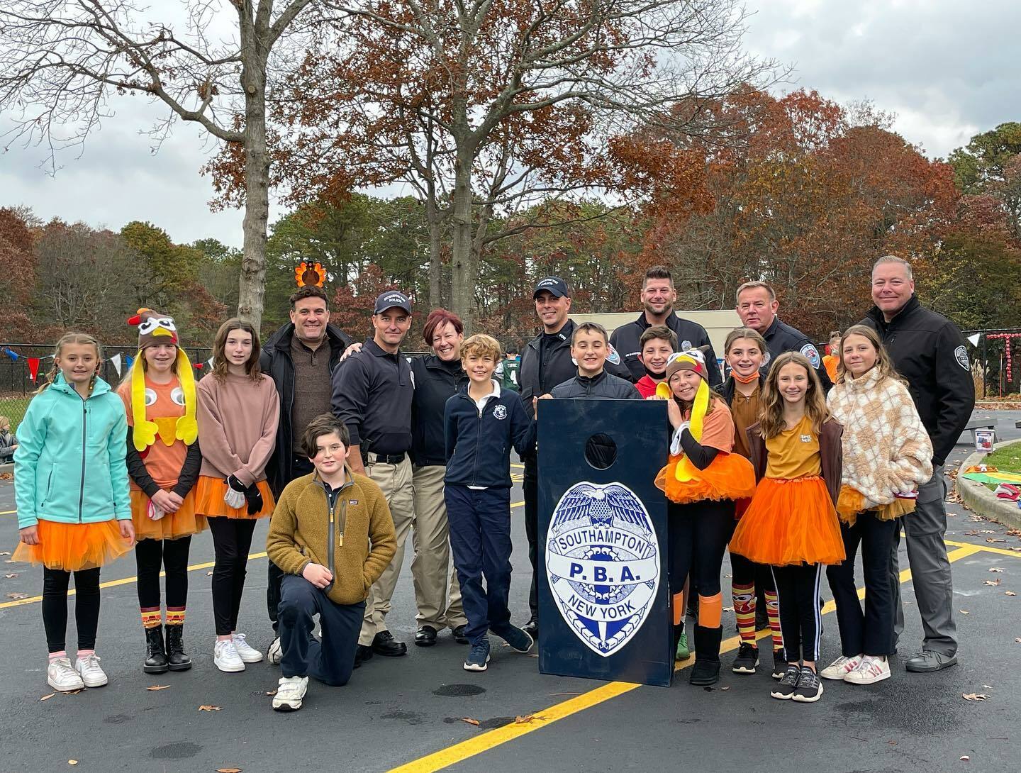 Sixth-grade students from Raynor Country Day School went head to head with the Southampton Town Police Department in a cornhole competition recently.