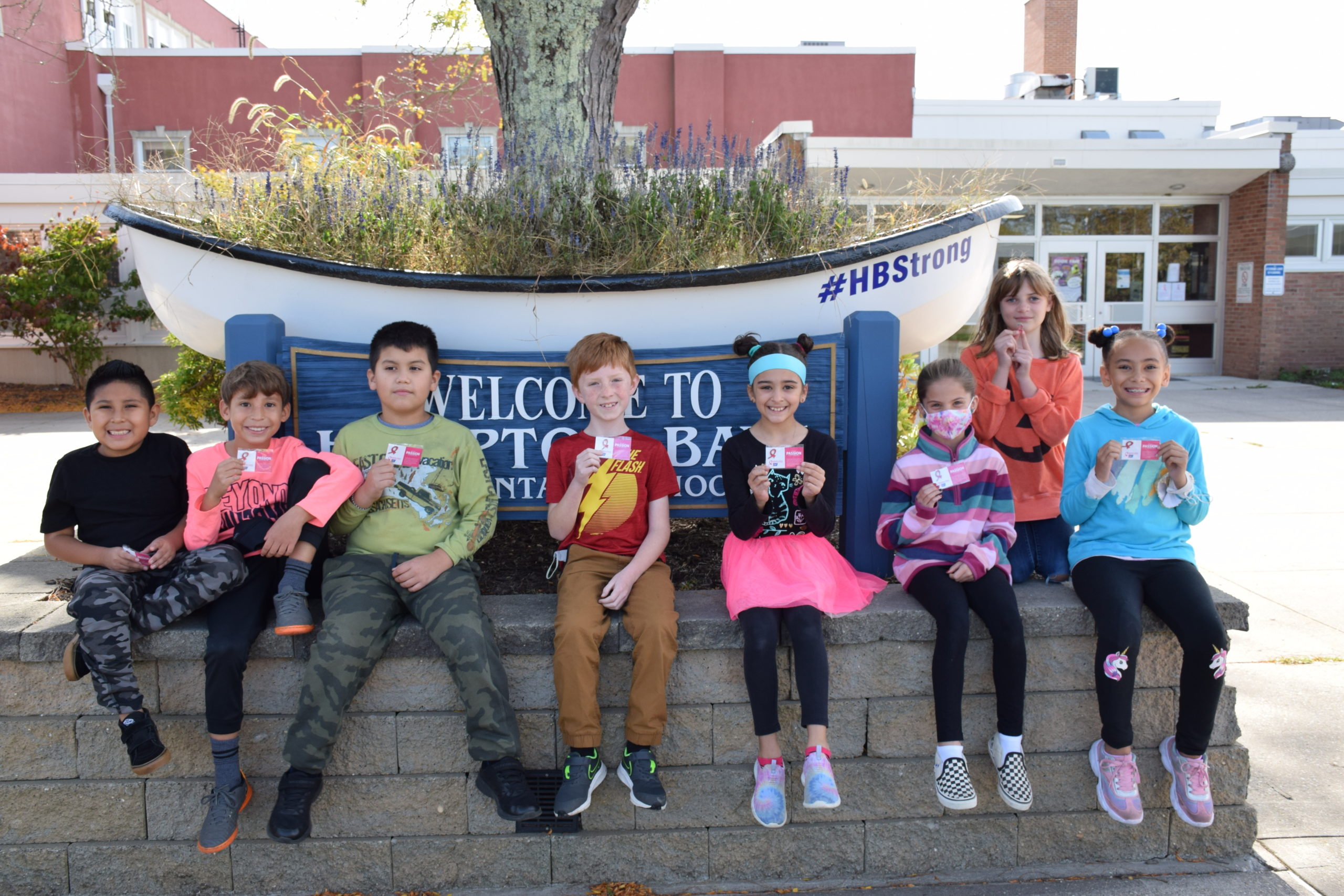 Members of the Hampton Bays Elementary School service organization, K-Kids, recently donated more than $500 to the American Cancer Society as part of their annual Denim Day fundraiser. They raised the funds by selling breast cancer awareness bracelets and pins to fellow students, teachers and administrators. Students and staff also wore jeans and the color pink on October 22 in honor of the cause.