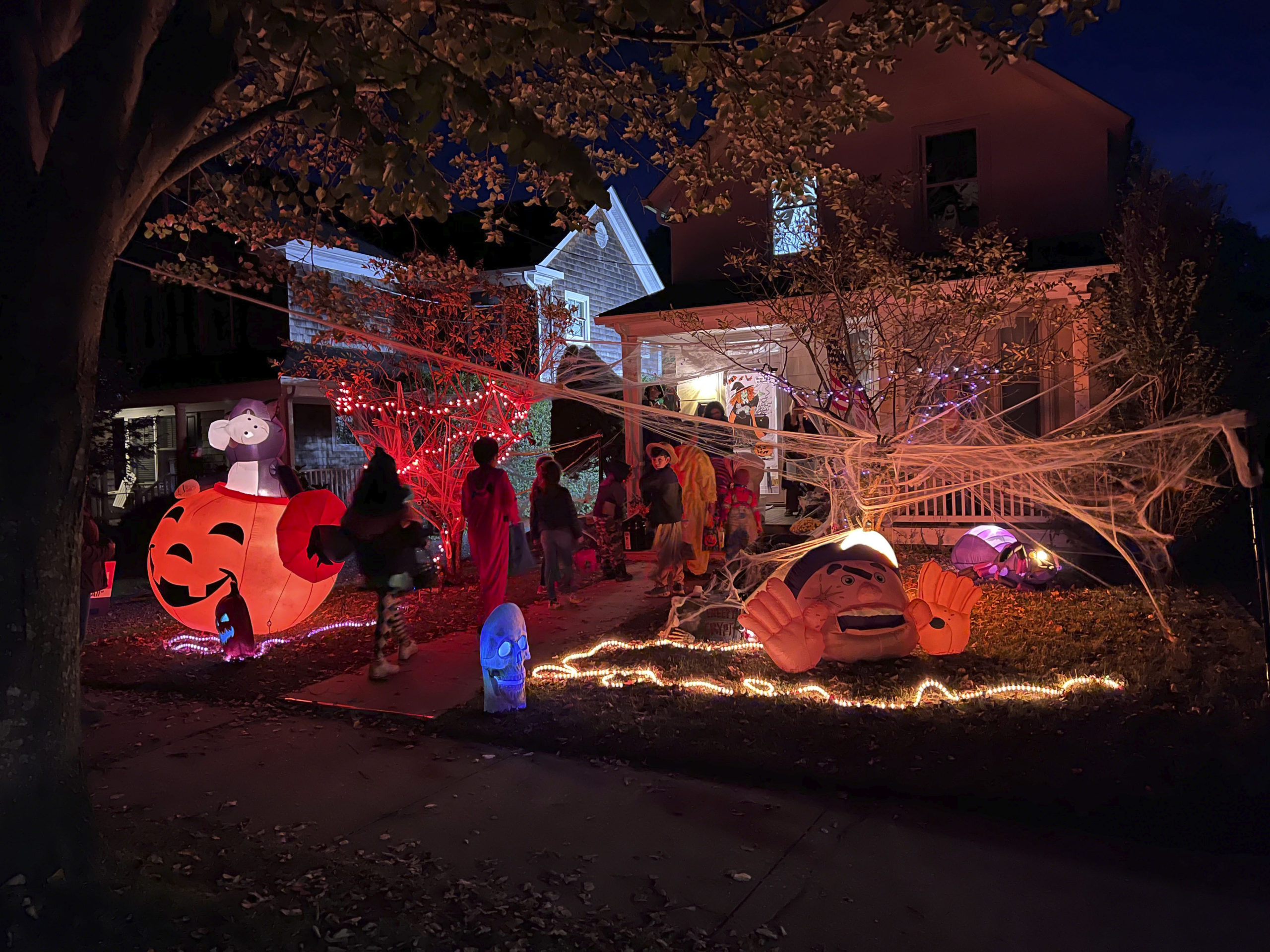 Trick or Treaters visit Elm Street on Halloween night.  DANA SHAW