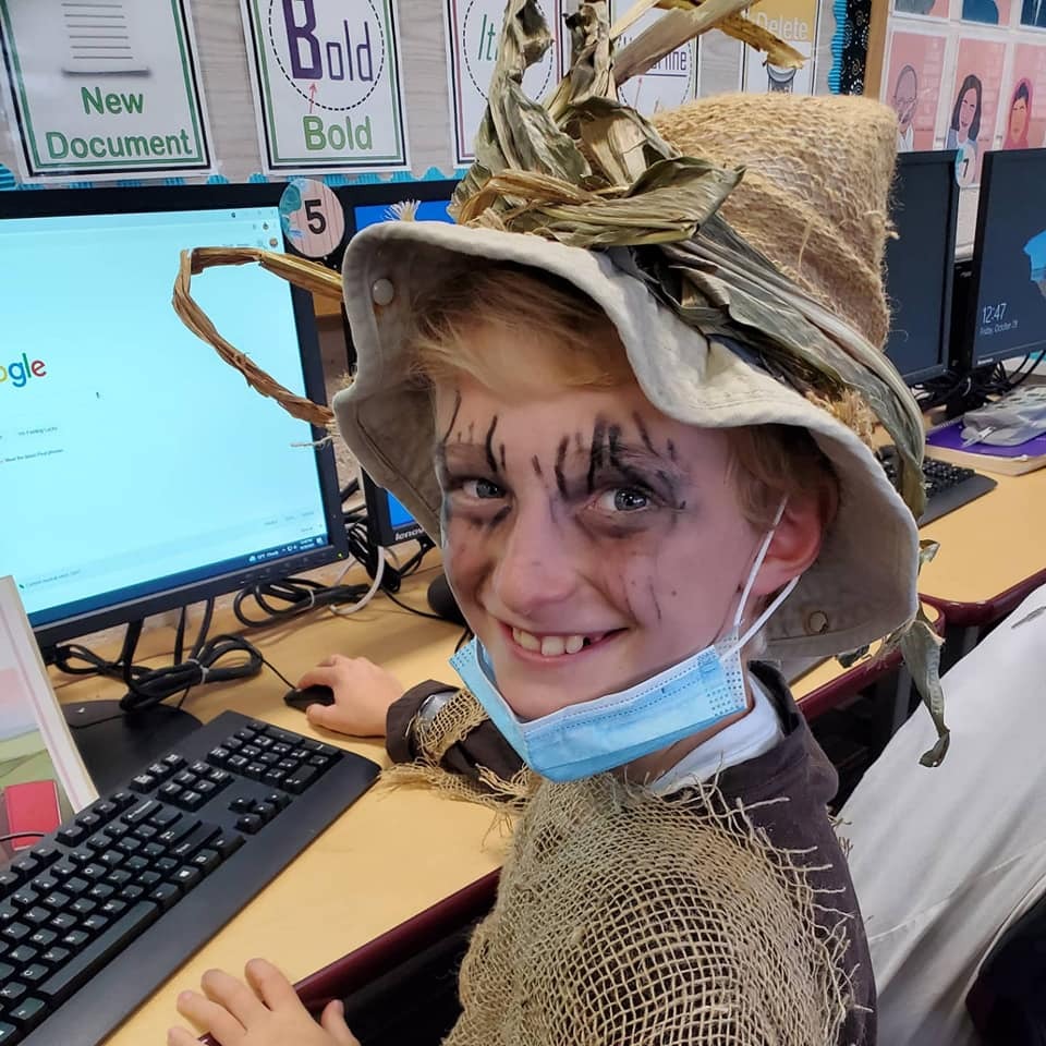 Our Lady Of The Hamptons Schoo fifth-grader Oliver Fulweiler dressed as a scarecrow in computer class.
