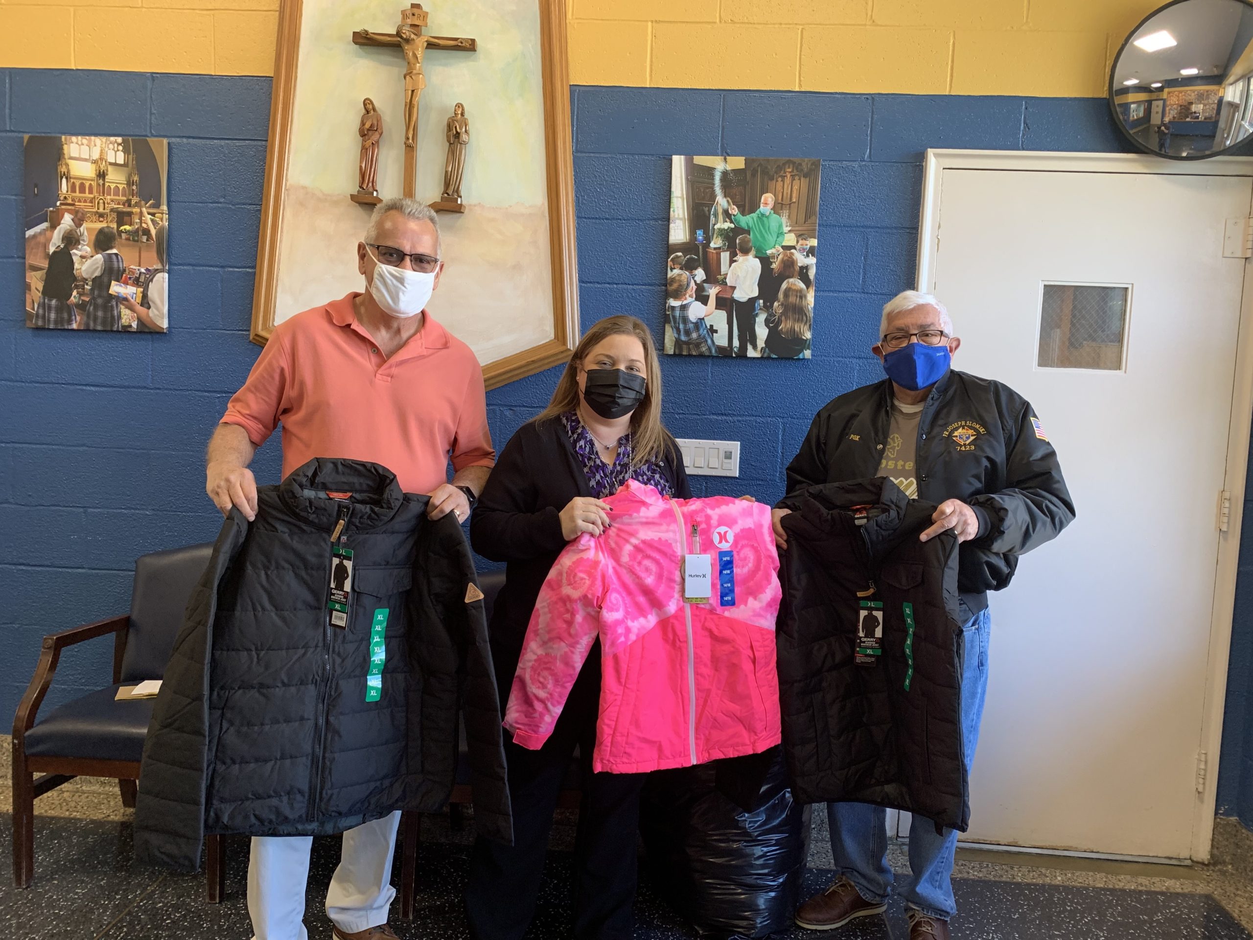 The Father Slomski Council of the Knight of Columbus held its annual Coats for Kids program this year, handing out 168 coats at seven schools on the East End recently. From left, Knight Mike Doyle, Westhampton Beach Middle School Principal Dawn Waller, and Knight Phil Debrita.