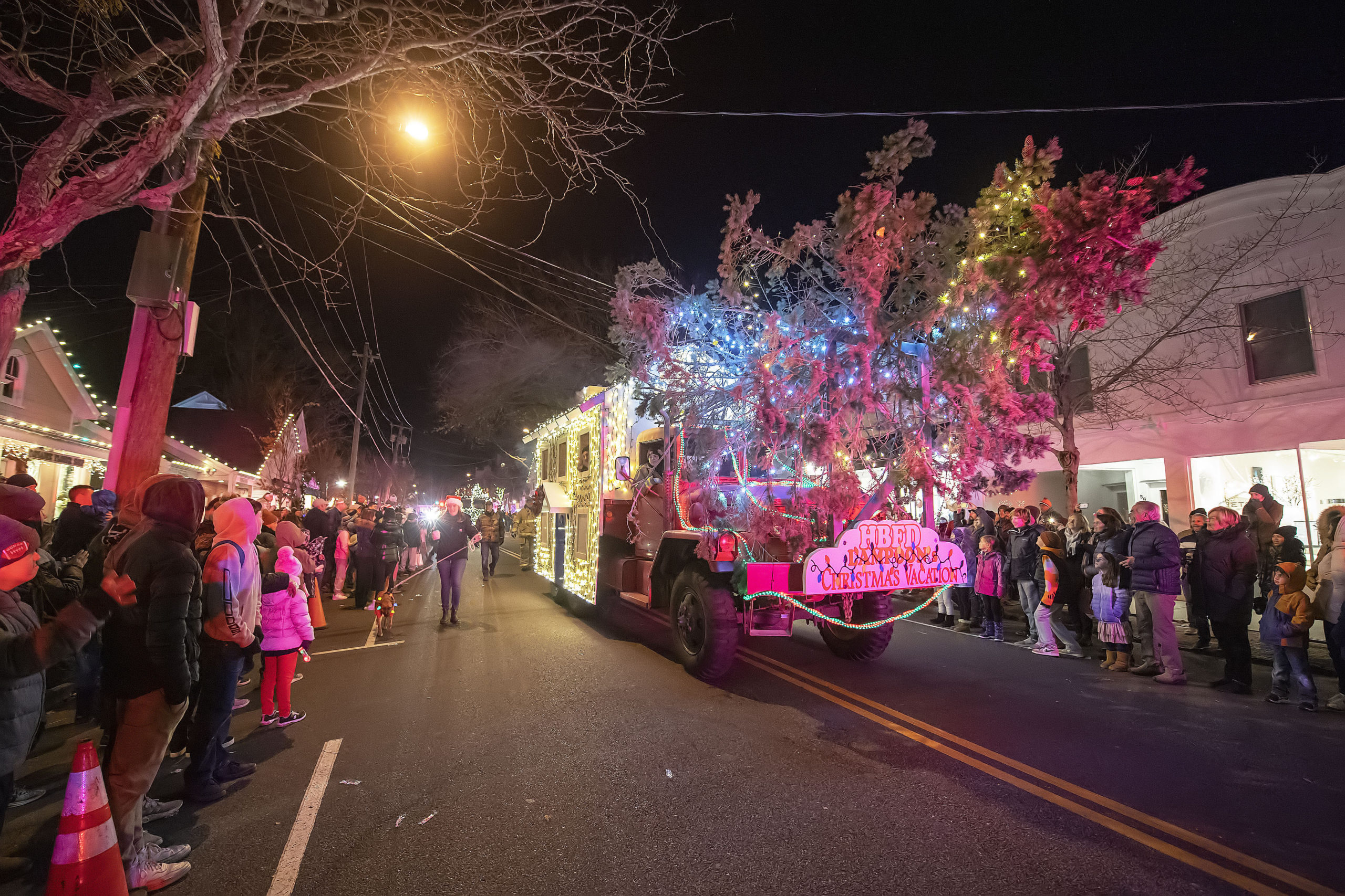 The Hampton Bays Fire Department's National Lampoon Christmas Vacation entry delights the crowd during the 2021 Parade of Lights along Jobs Lane on Saturday night.    MICHAEL HELLER