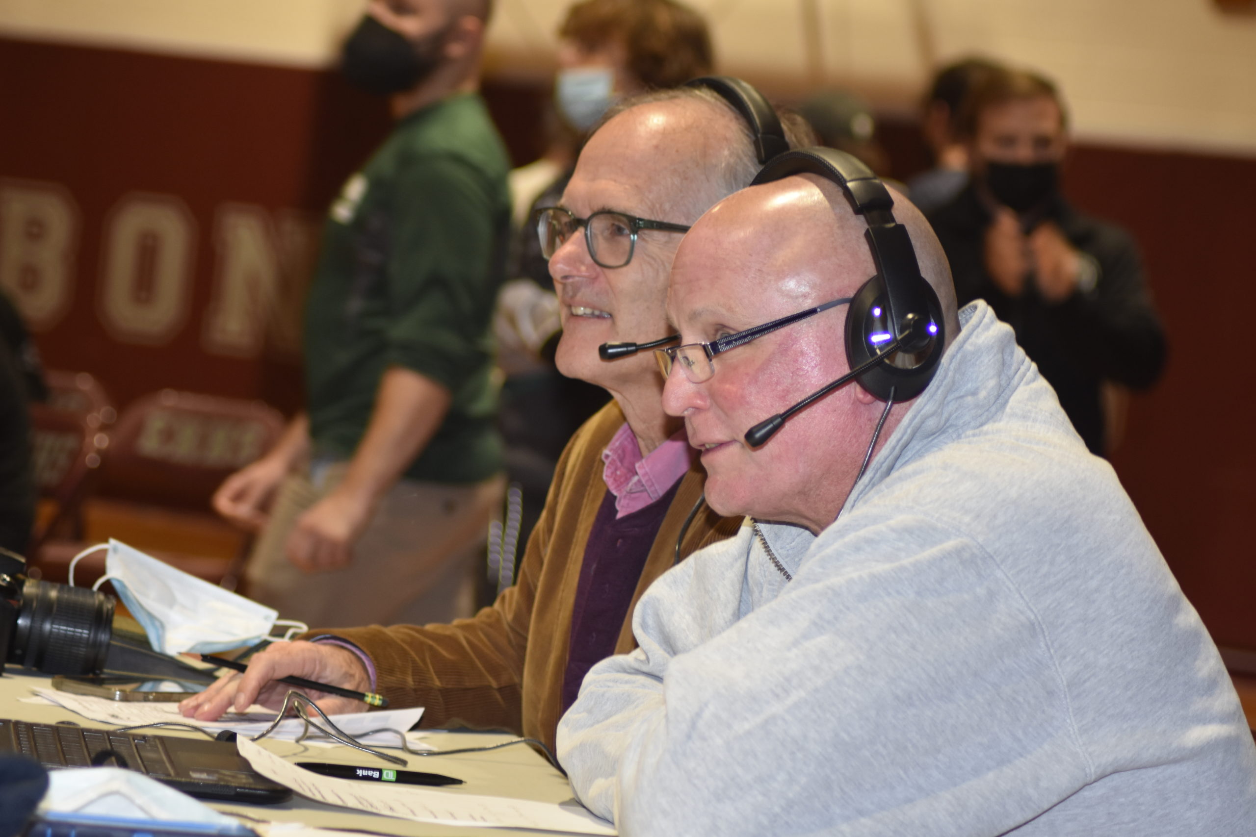 A pair of East End wrestling legends, Jim Stewart, left, and Paul Bass, did some commentary during the livestream of Friday night's match between host East Hampton and Westhampton Beach.