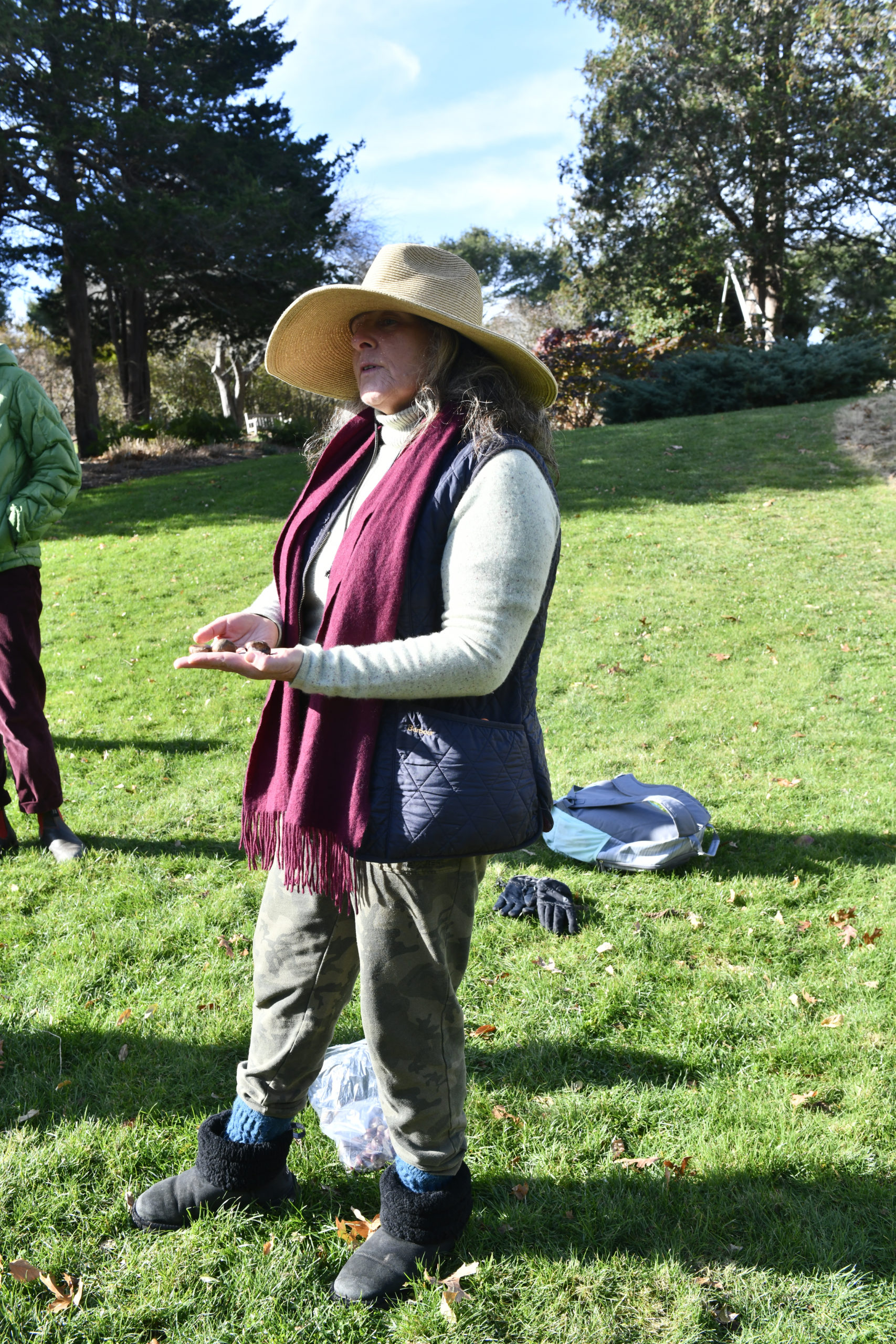 April Gonzales talks to children from the Hayground School about chestnuts at Bridge Gardens Bridgehampton recently.  DANA SHAW