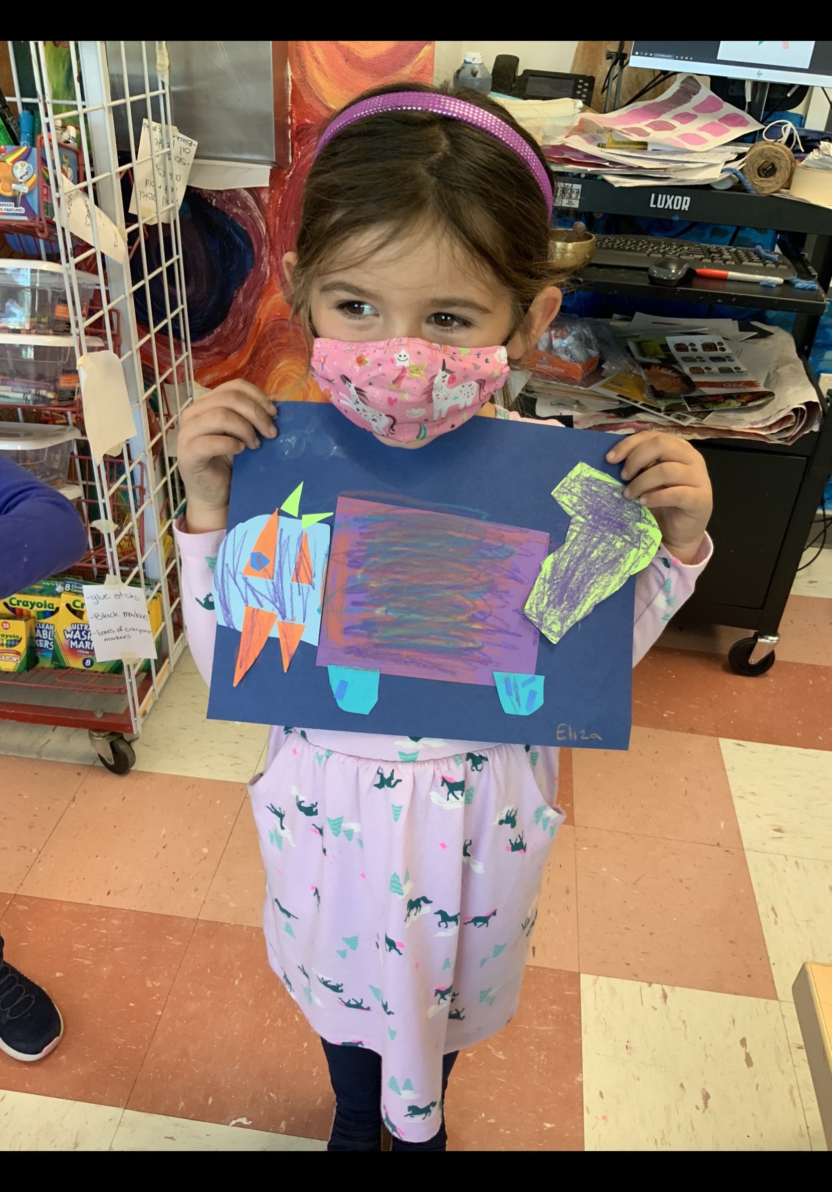 East Quogue Elementary School kindergartner Eliza Strong shows off her cutting and gluing skills.