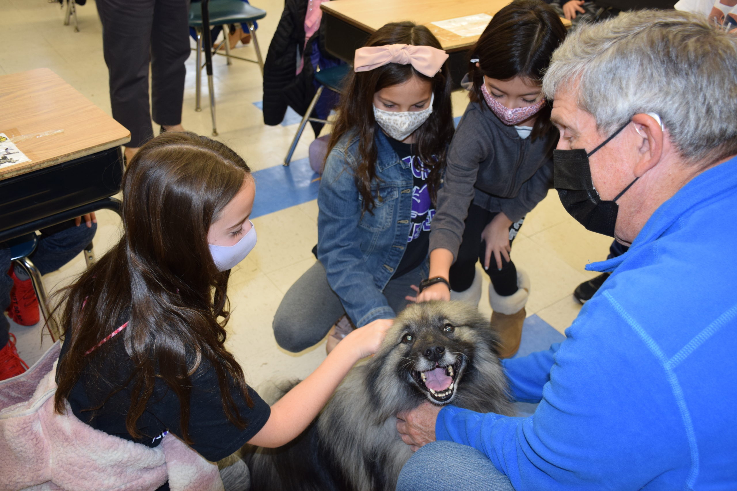 Hampton Bays Elementary School students enjoyed spending time with Ray, a therapy dog from Love on a Leash.
