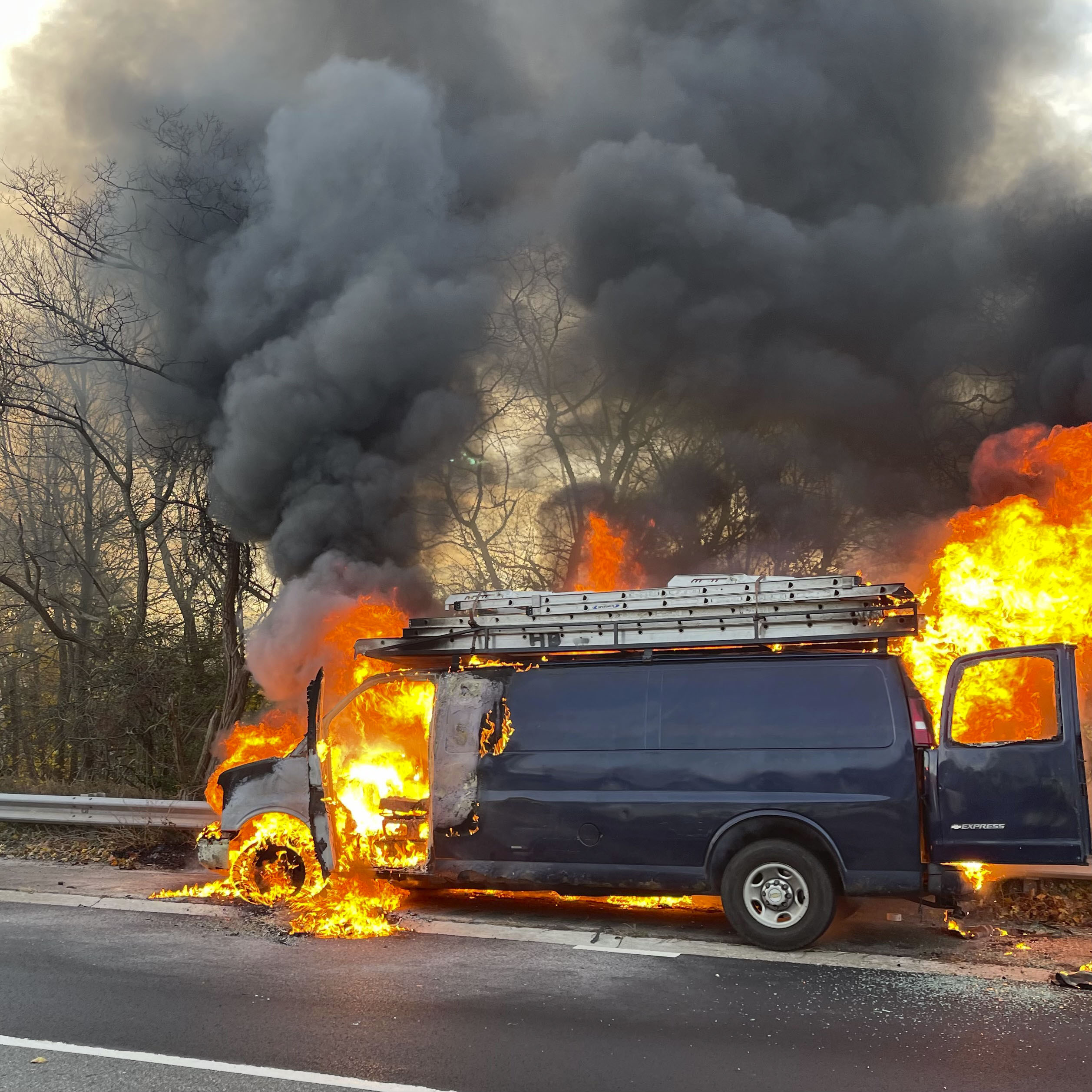 The Hampton Bays Fire Department battled a vehicle fire on Tuesday morning on Sunrise Highway which caused traffic to back up during rush hour.   COURTESY HAMPTON BAYS FIRE DEPARTMENT
