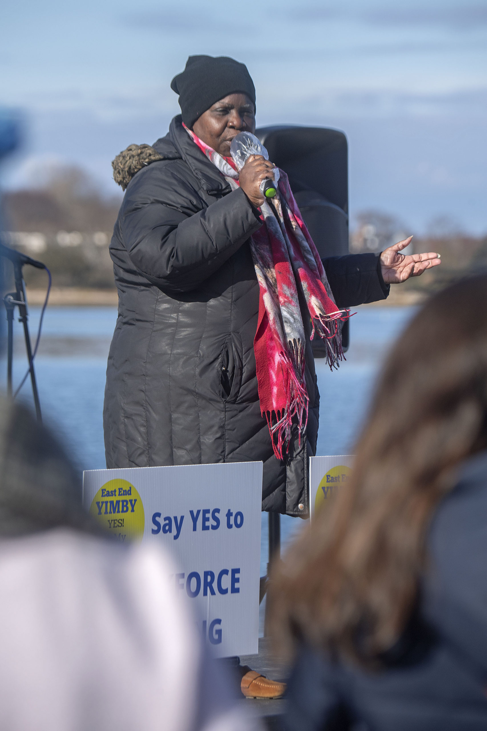 Bridgehampton Child Care Center Executive Director Bonnie Cannon speaks at the East End YIMBY Rally for Affordable Housing, at the windmill on Long Wharf in Sag Harbor on Saturday.  MICHAEL HELLER