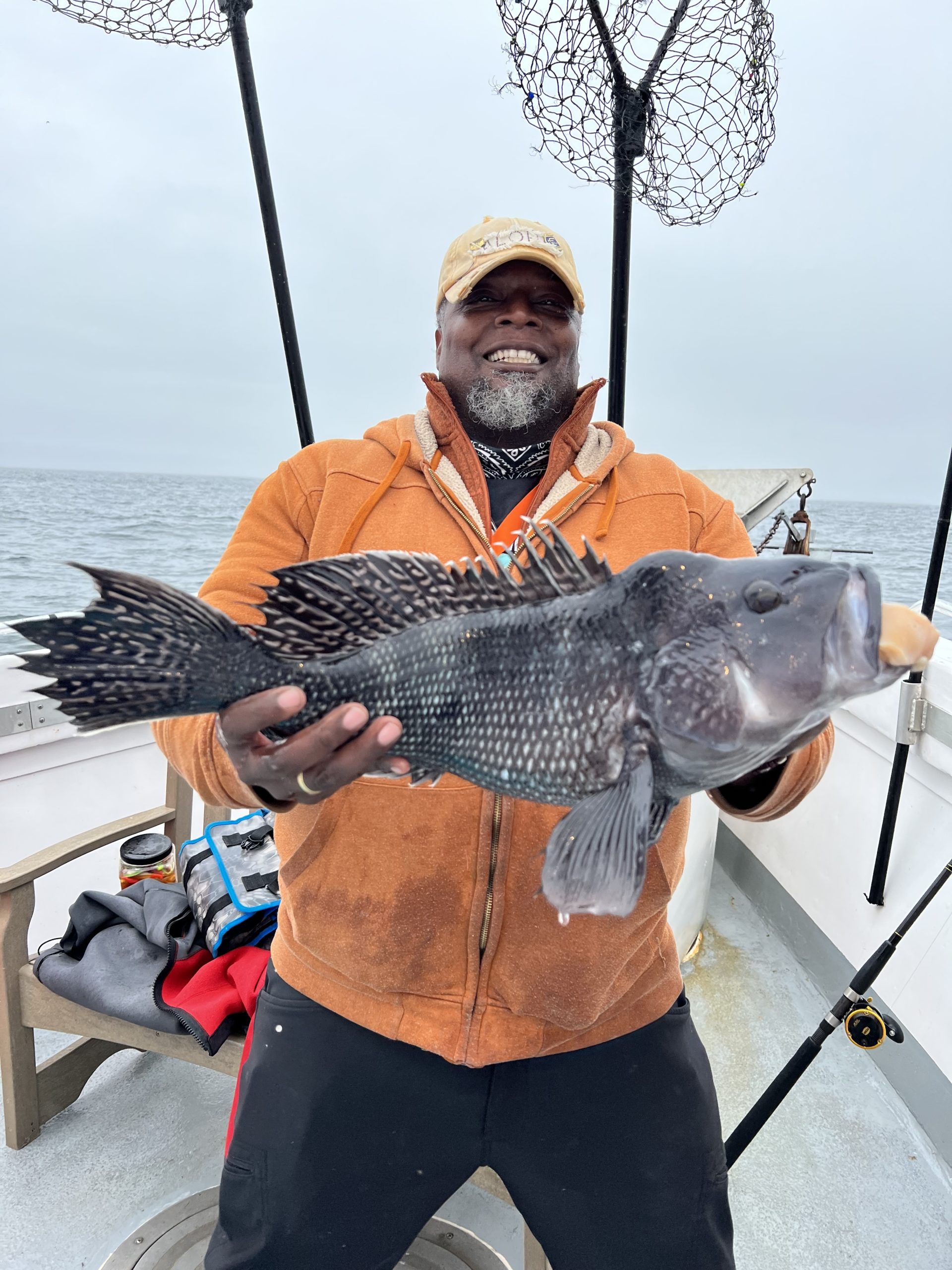 Gene Hamilton with a big black sea bass caught aboard the Hampton Lady as the season wound down last week.