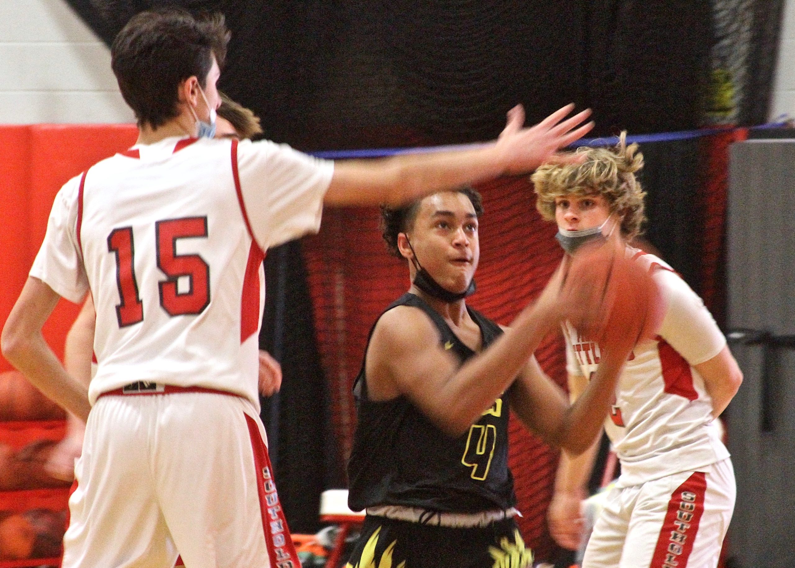 Eighth-grade guard Alex Davis muscles his way to the basket. DESIRÉE KEEGAN
