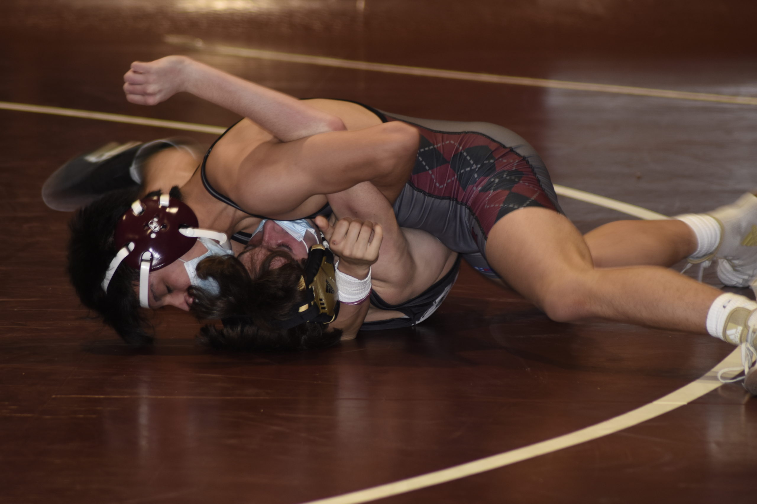 East Hampton's Juan Roque scores points on Babylon's Paul Forthmuller. Roque won by technical fall in the third period.