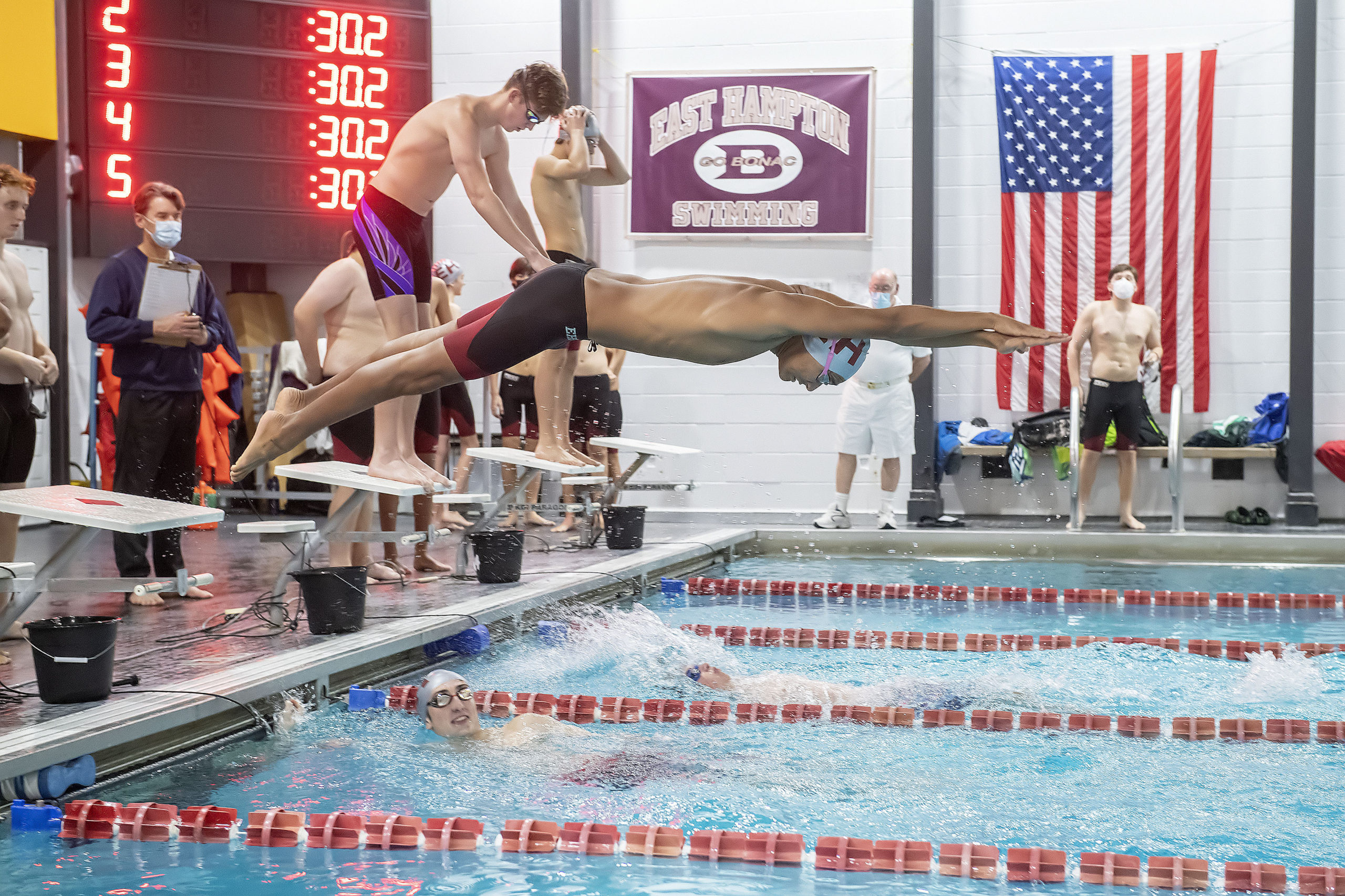 East Hampton's Tenzin Tamang launches himself to begin the second leg of the 200-yard medley relay.
