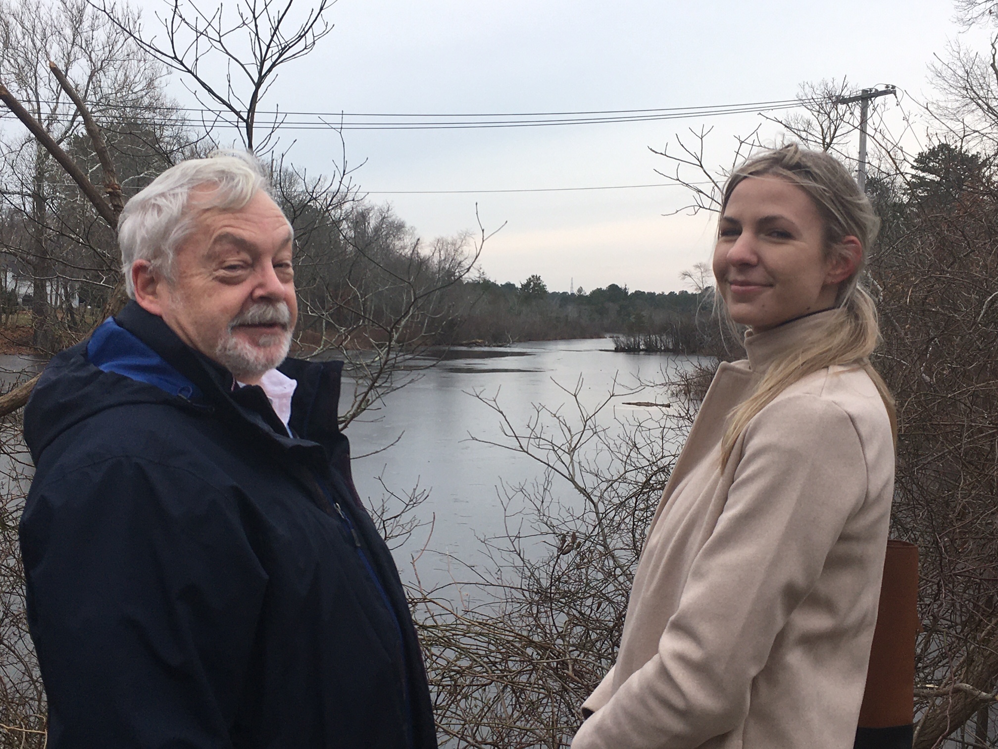 Southampton Town Councilman John Bouvier and Valerie Virgona of the Peconic Estuary Partnership  at the dam site in Riverside.            KITTY MERRILL