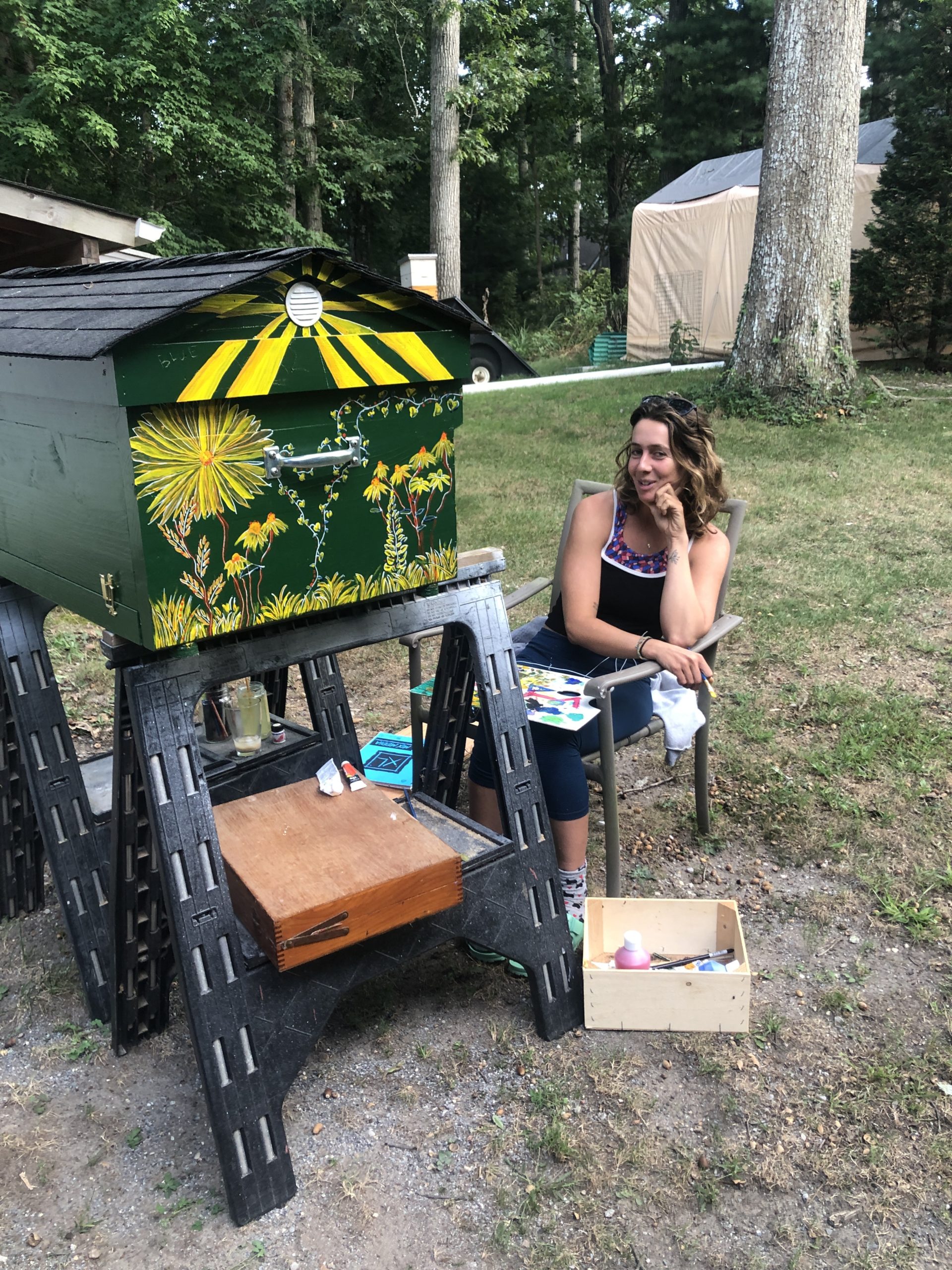 Allison O’Connor working her magic on a new hive.