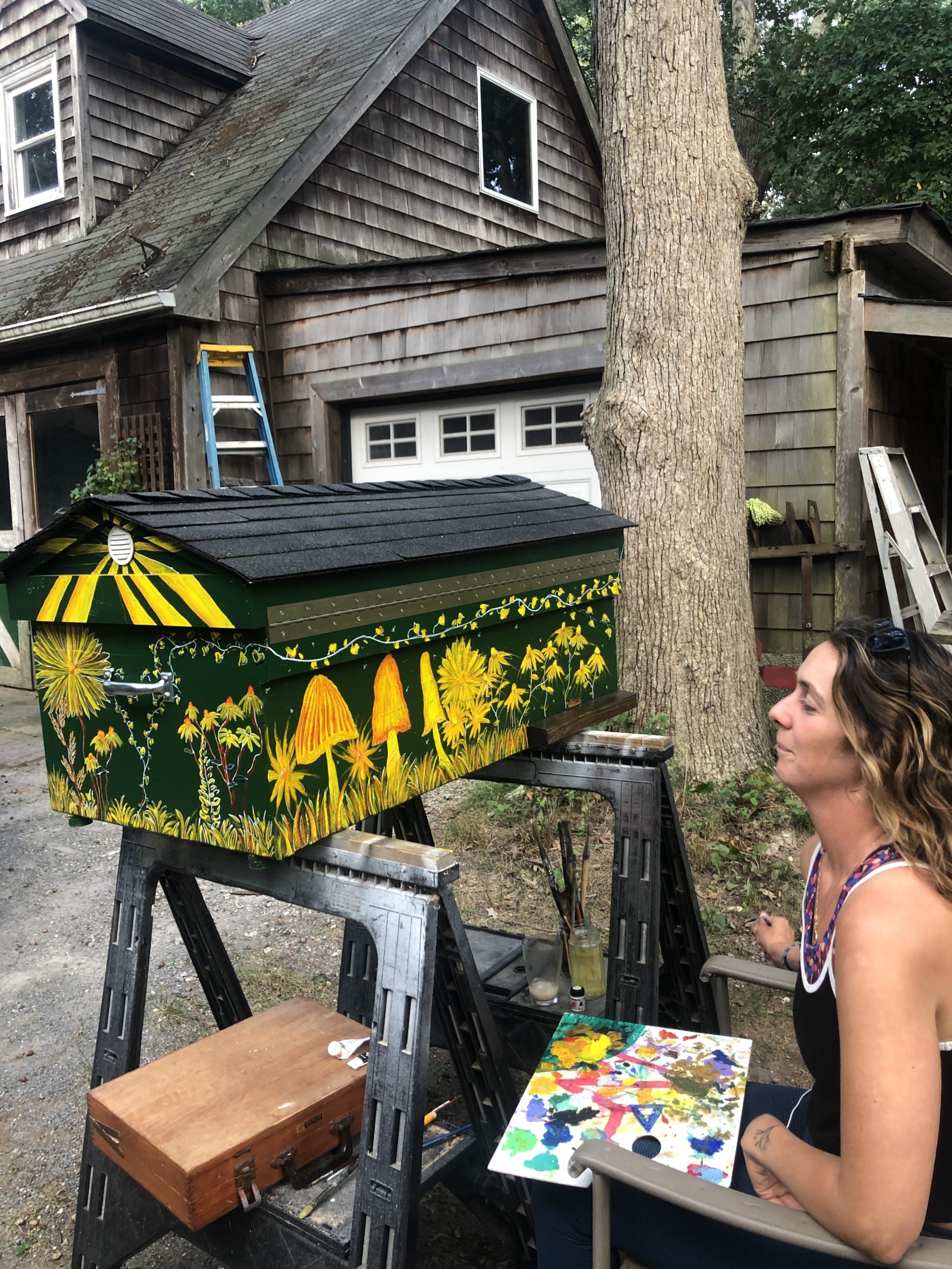 Allison O’Connor working her magic on a new hive.