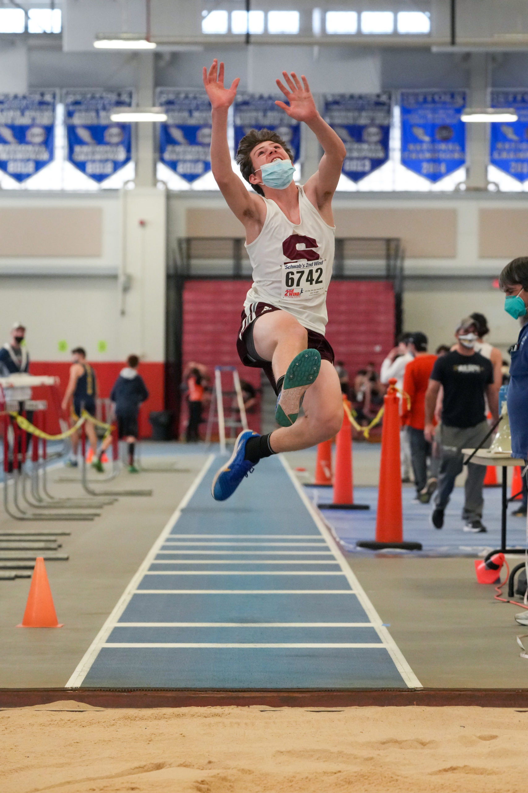 Mariner Thayer Schwartz making his leap in the long jump.
