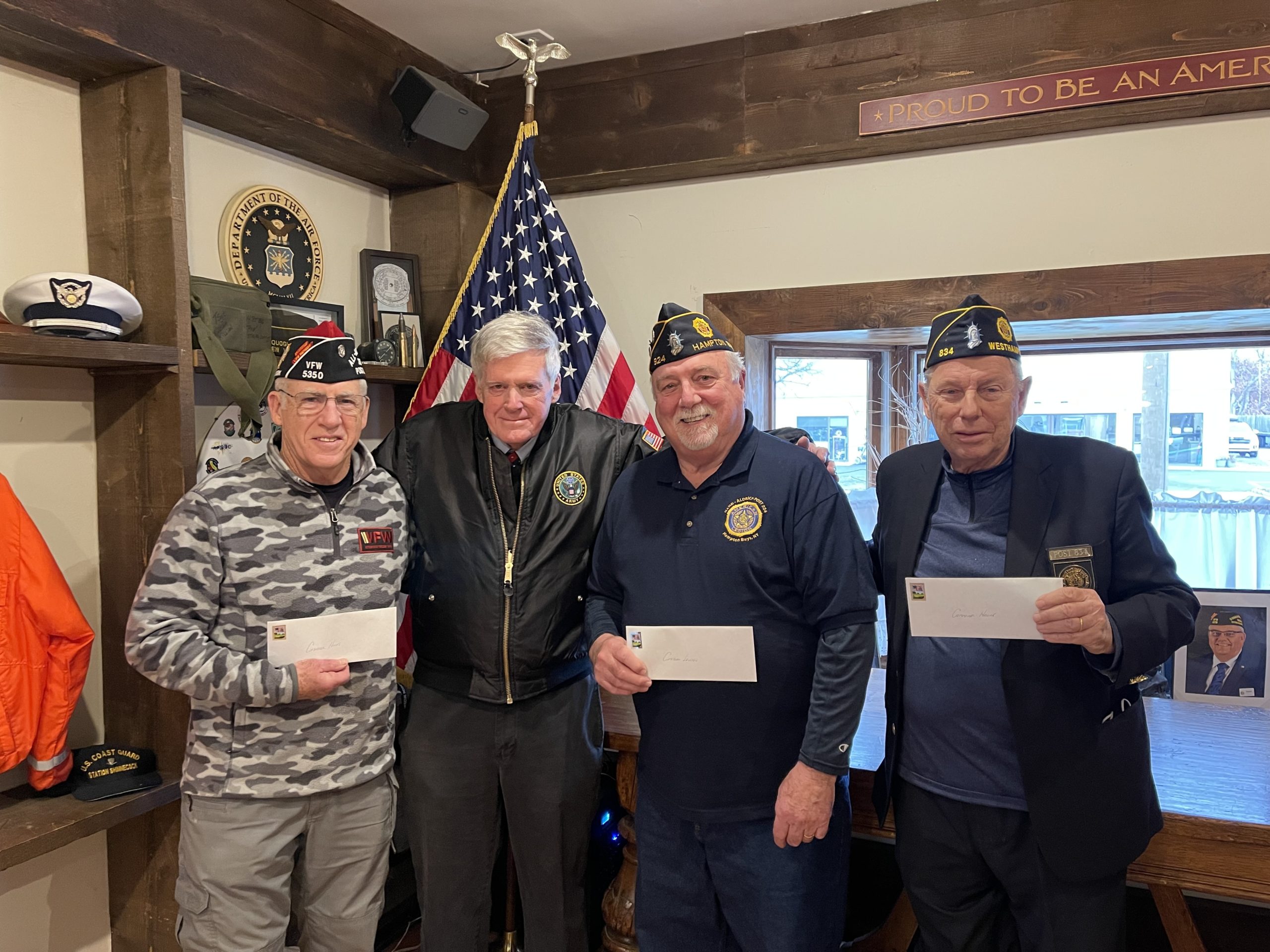 Checks totally $4,000 were presented to commanders of local veterans posts on Friday, January 14, during a gathering on the Westhampton Beach VFW headquarters. The check represented each posts portion of the proceeds of the Warriors Rock concert, which took place over Veterans Day weekend at the Westhampton Beach Performing Arts Center. From left,  during a brief ceremony at which the commanders of local veteran posts were presented with checks from the Warriors Rock band covering their portion of proceeds from the Veterans Day Weekend concert held at the Westhampton Beach Performing Arts Center.  From left,  William Hughes, commander of the Westhampton VFW Post; George M. Motz, representing  the nonprofit Warriors Rock; John Lenihan, commander of the Hampton Bays American Legion Post; and Thomas Hadlock, commander of the Westhampton American Legion Post.