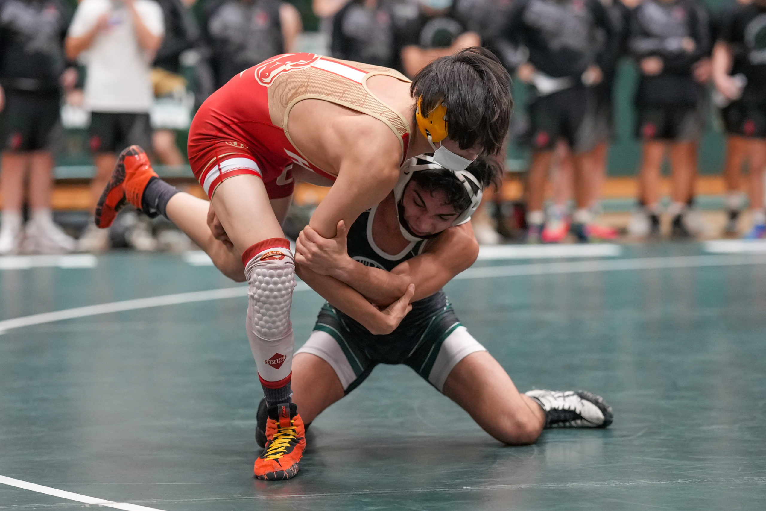 Randy Cabrera of Westhampton Beach works on Donghyun Lee of Hills West, whom he beat, 6-2.