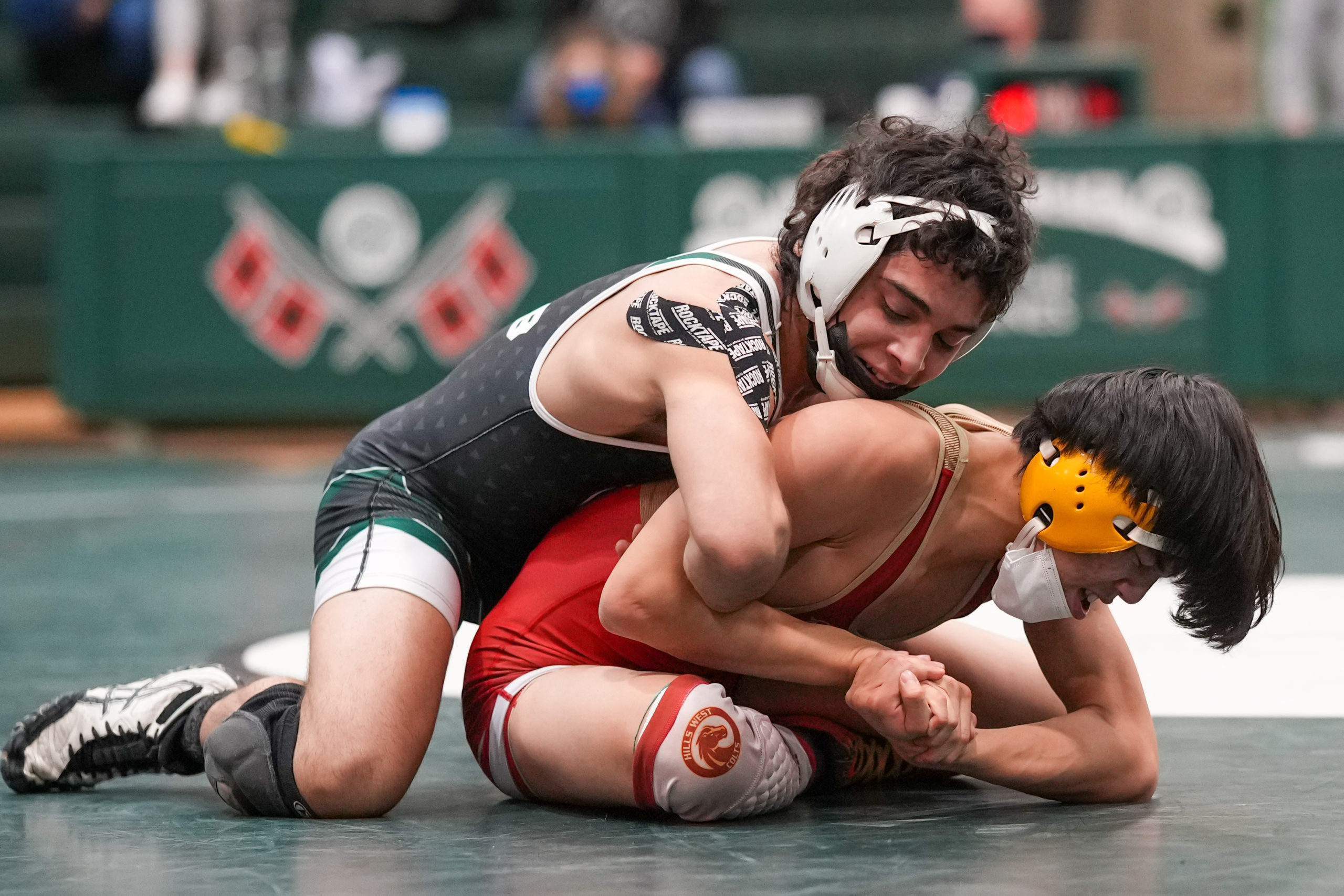 Randy Cabrera of Westhampton Beach works on Donghyun Lee of Hills West, whom he beat, 6-2.