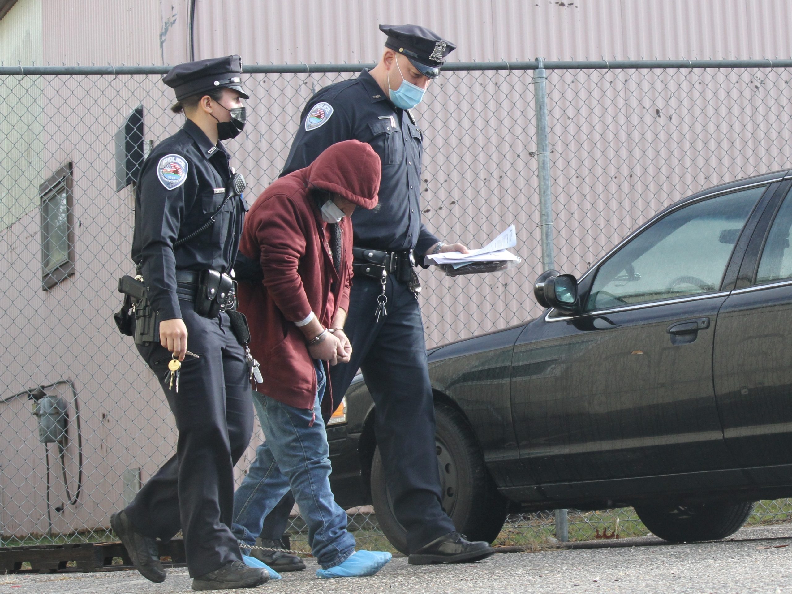 Dominick Parisi is led out of Southampton Town Justice Court on Monday morning after being arraigned on murder charges stemming from the Christmas morning shooting death of Steven Byrnes on Roses Grove Road in North Sea.