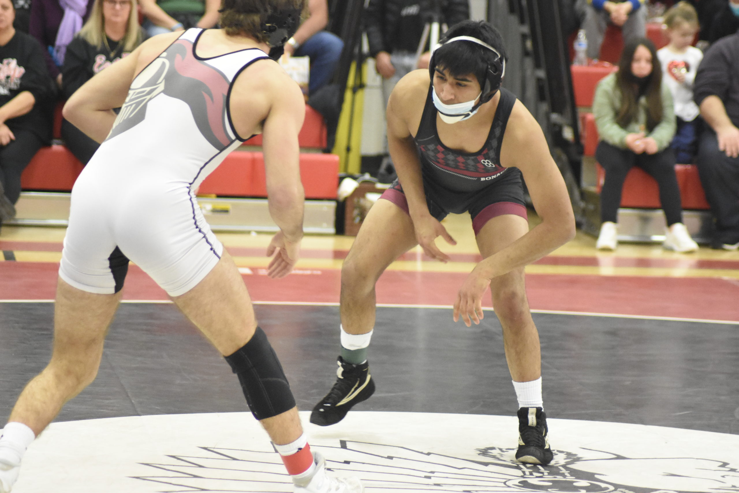 Bonac senior Caleb Peralta faced off against Vin Ziccardi of Kings Park for the 126-pound League V title on Saturday.