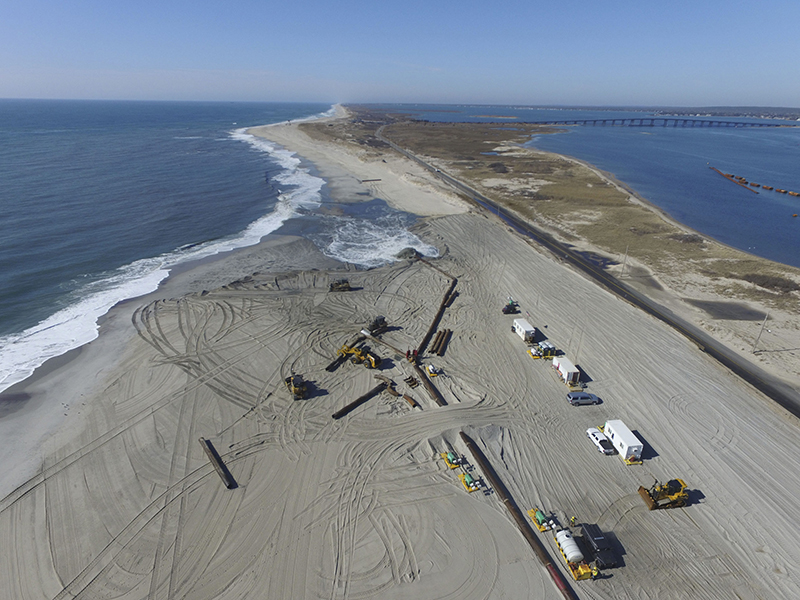 Dredging crews rebuilding the beaches west of Shinnecock Inlet in February 2020. Federal funding for massive new nourishment projects in Hampton Bays