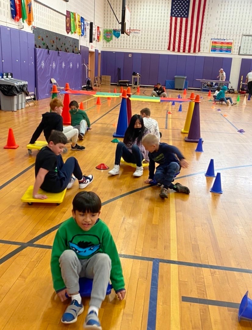 Hampton Bays Elementary School students recently practiced traffic safety and learned more about traffic signs in their physical education classes. As part of the engaging tutorial, the school’s gym was transformed into a roadway that students navigated on roller scooters.