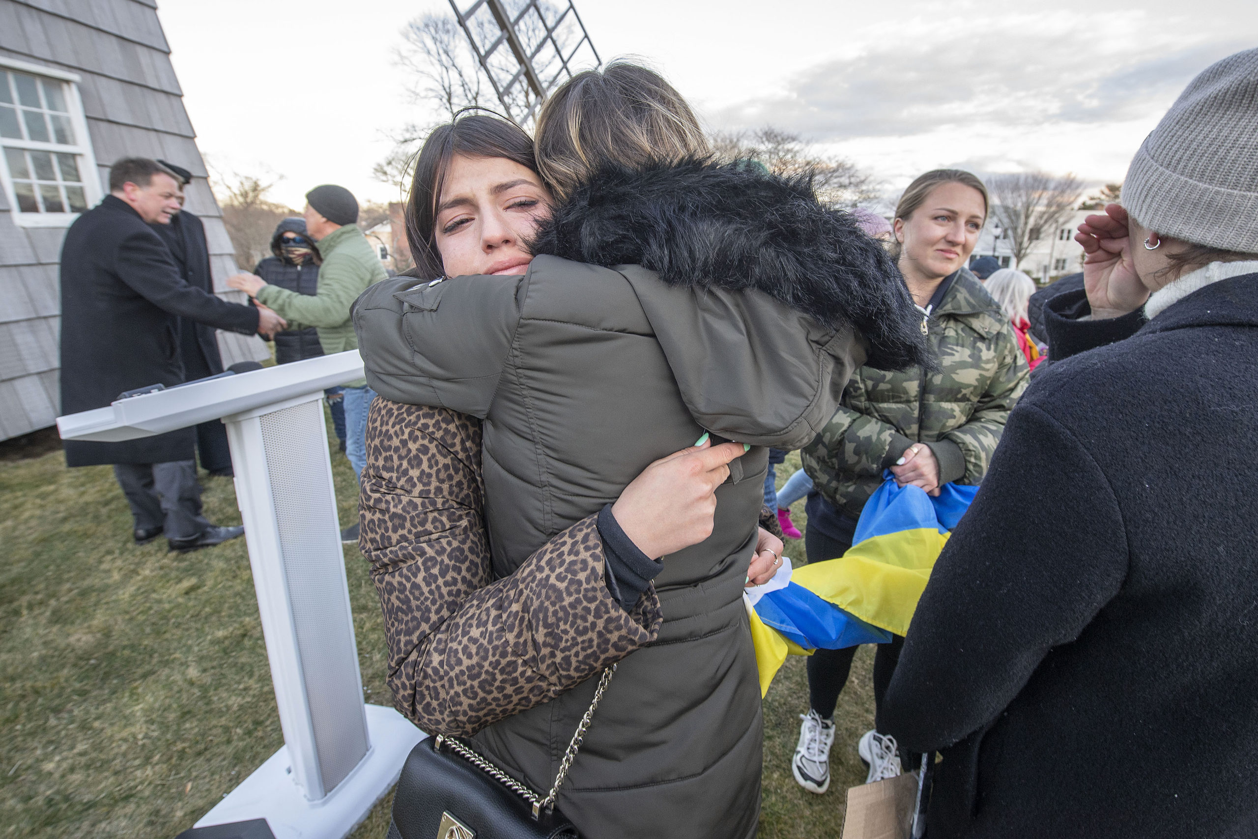 Vira Palamarchuk, whose father is fighting on the front lines in Ukraine, is comforted by a complete stranger during a rally last Thursday on the Hook Mill Village Green in East Hampton. MICHAEL HELLER