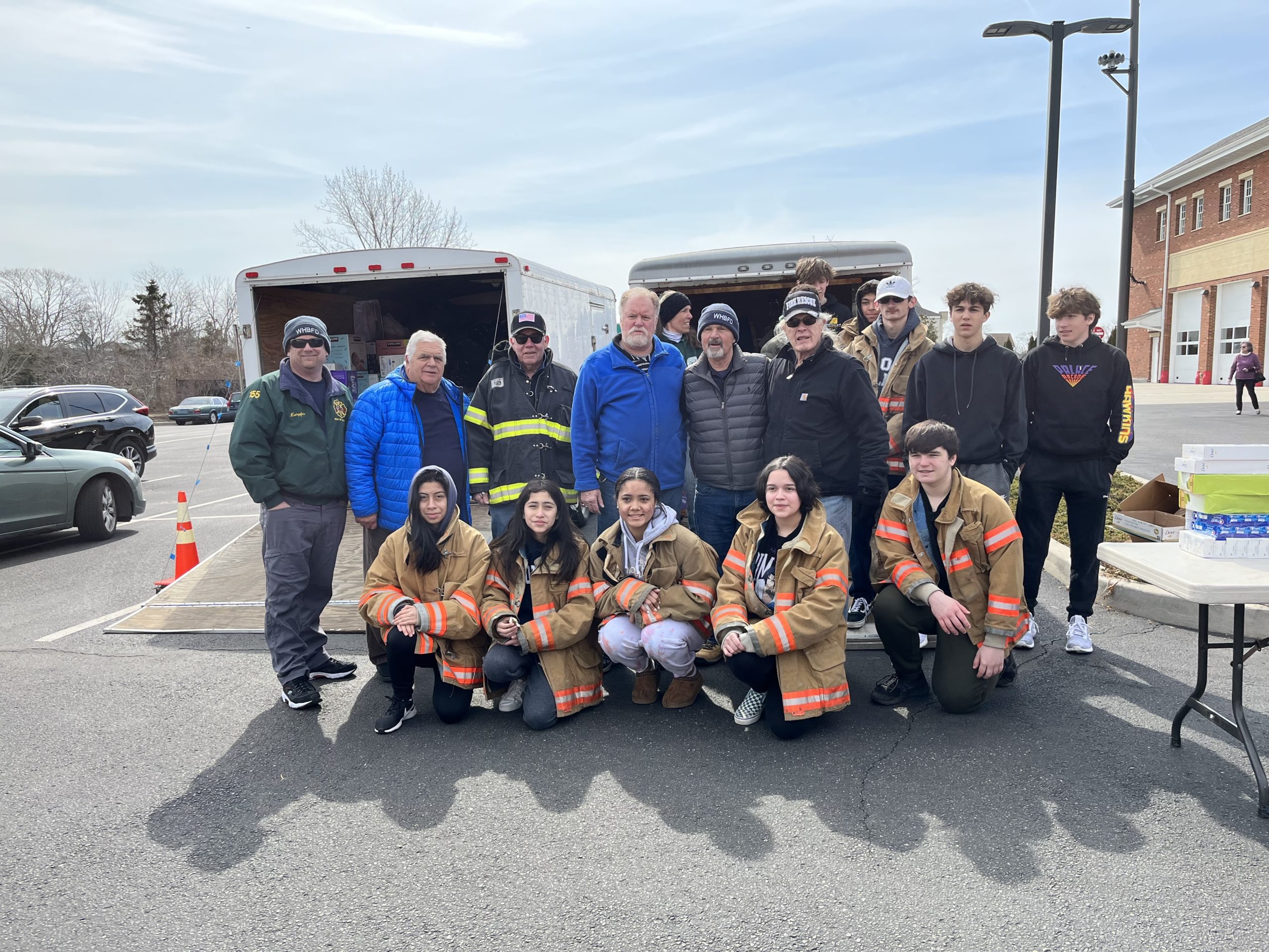 Members of the Father Slomski Council of the Knights of Columbus with members of the Westhampton Beach Fire Department after the Knights dropped off donations for Ukrainian relief to a drive being organized by the fire department.