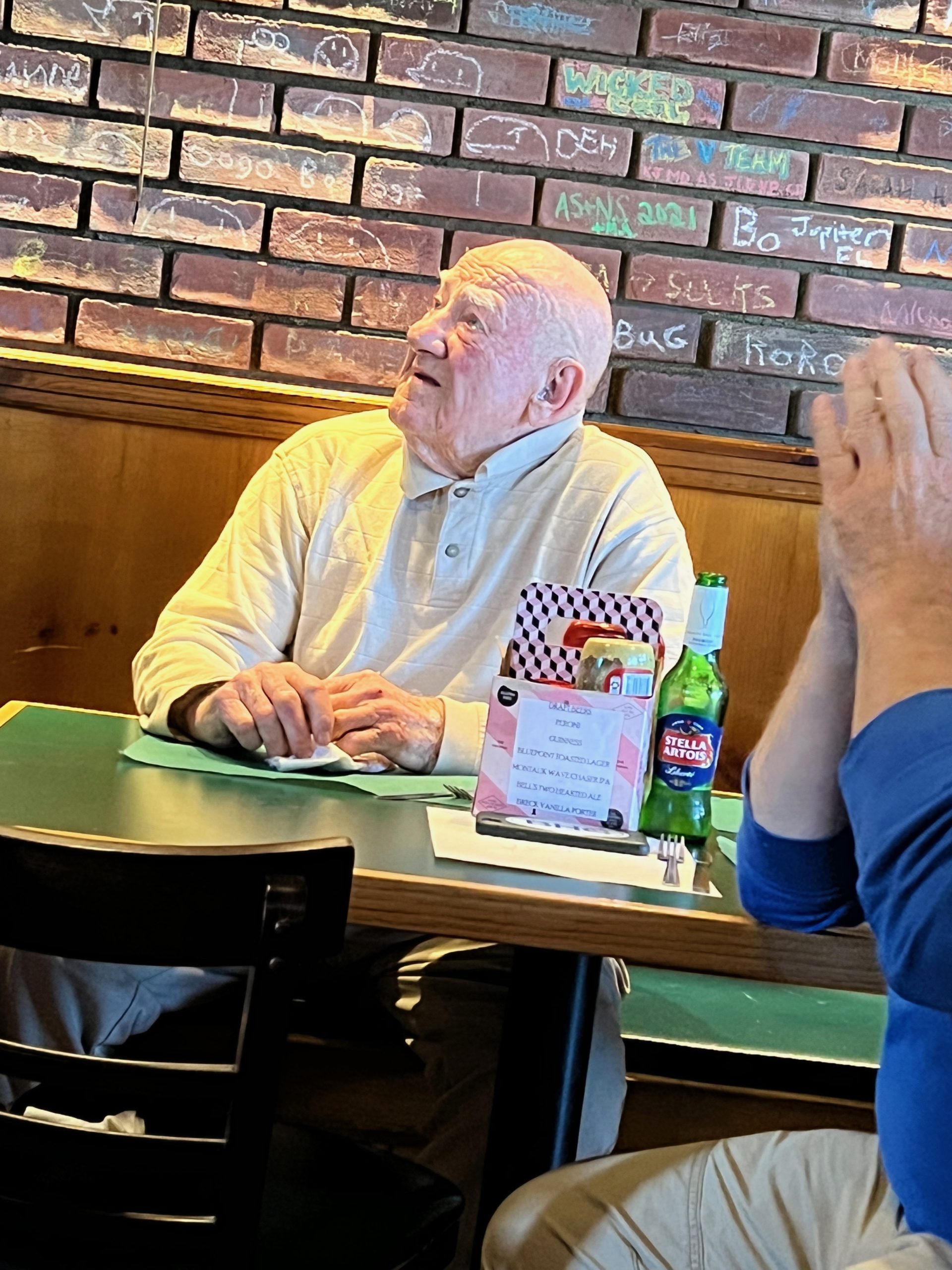 Former Pierson basketball coach Bob Vishno, who coached the Whalers to their one and only state championship in 1978, watching this year’s team compete last Friday on TV at the Corner Bar in Sag Harbor. The Whalers lost to Newfield, the eventual state champion, in the state semifinal, 66-62.